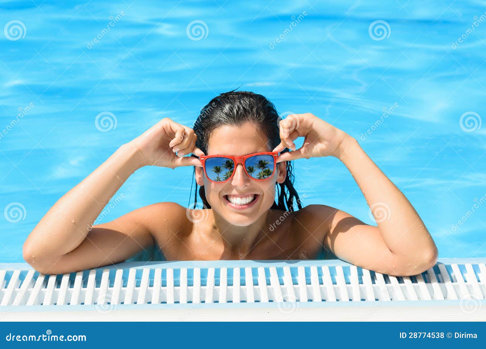 Happy Woman Enjoying Pool In Tropical Resort On Summer