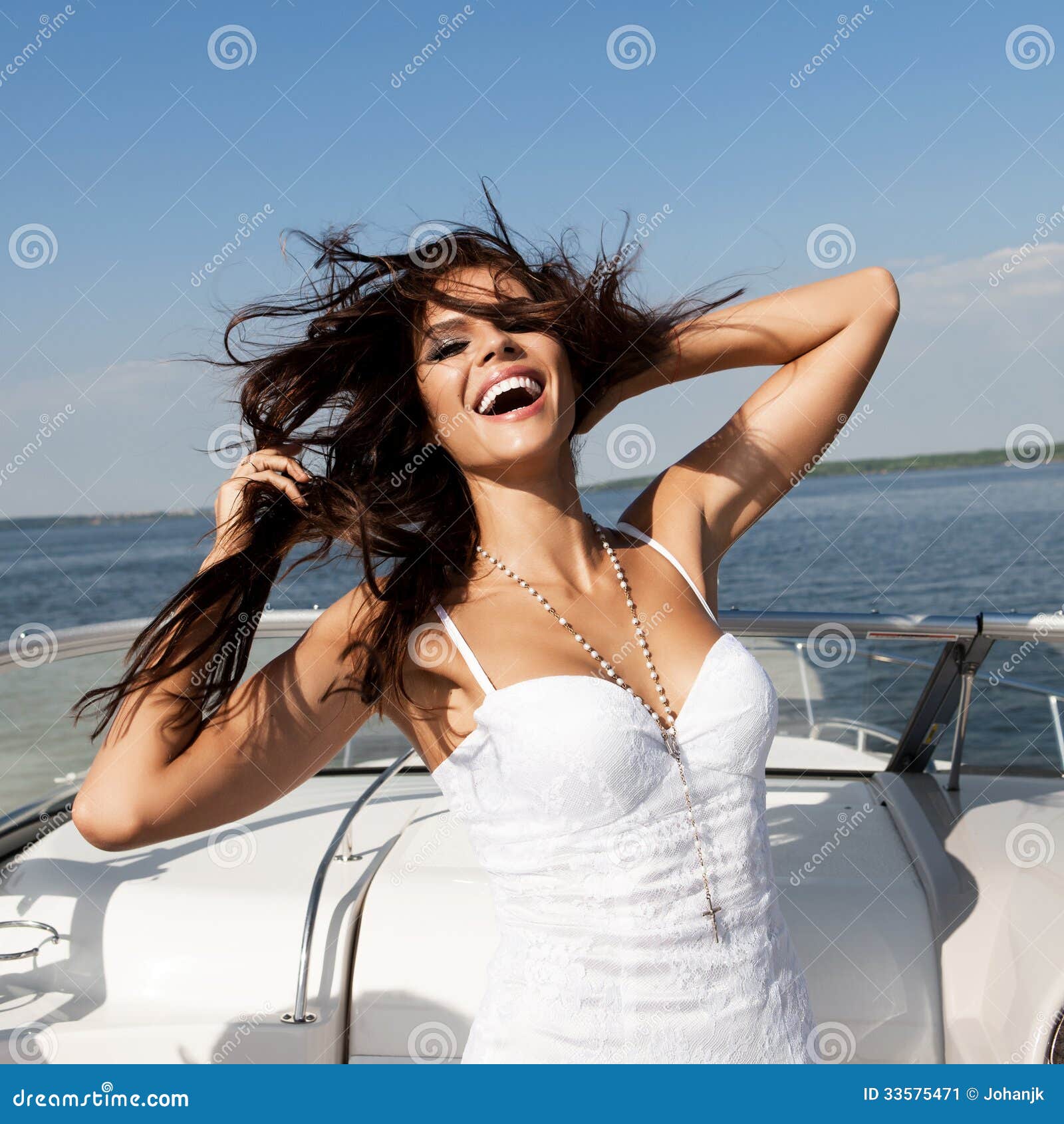 Boat happy woman smiling happy looking at the sea sailing by 