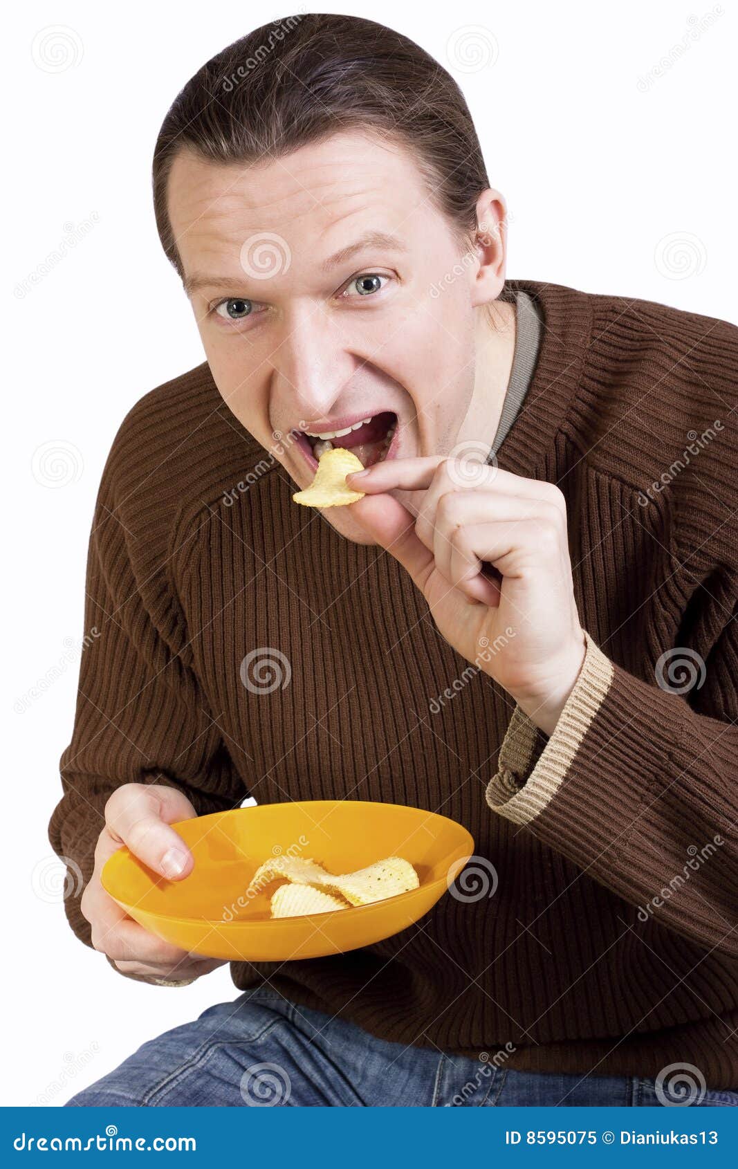 happy-young-man-eating-potato-chips-8595075.jpg