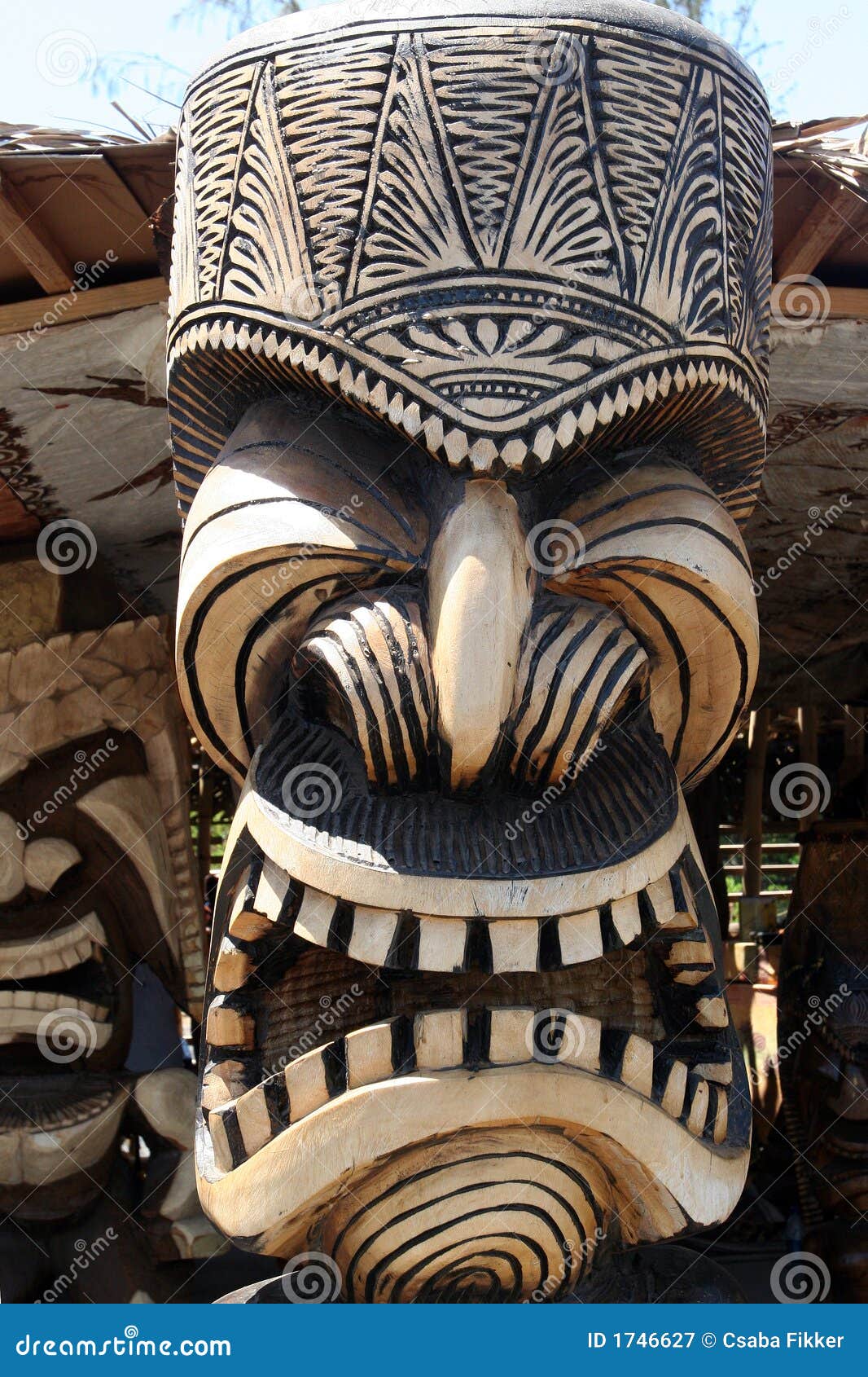 Hawaiian totem wooden carving with large mouth.