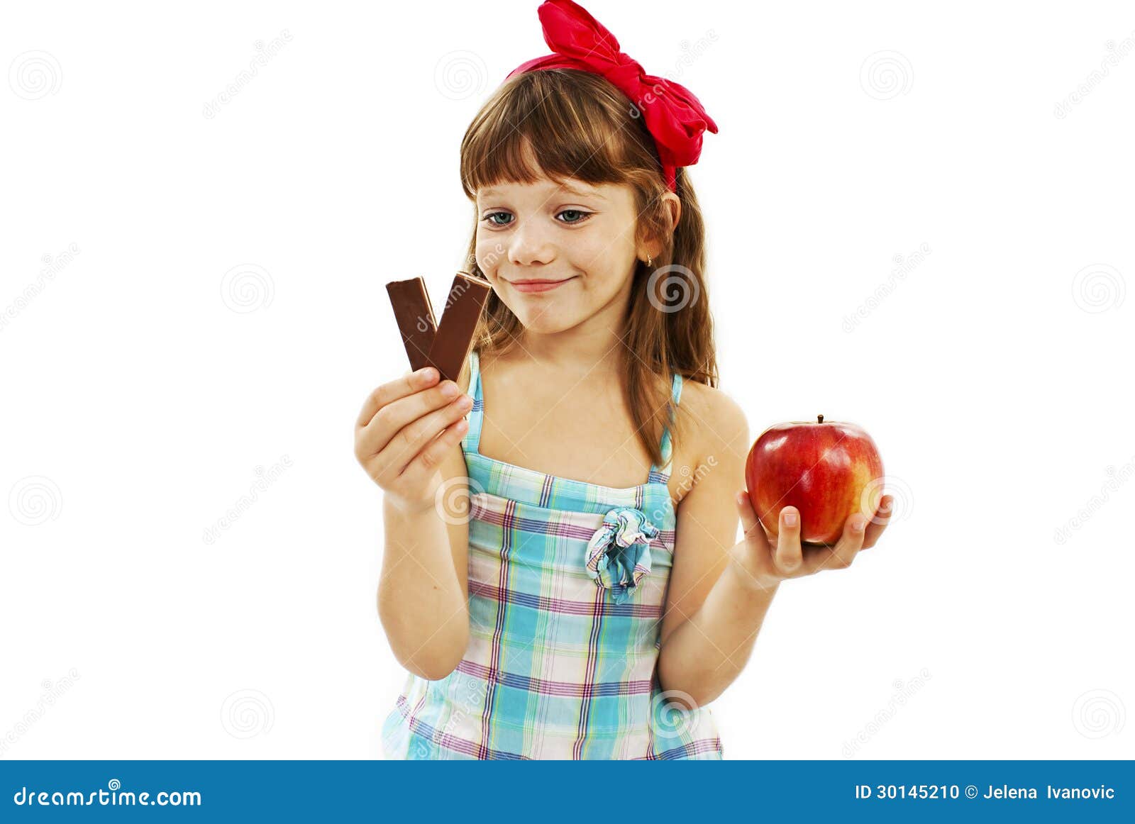 Healthy diet choices - little girl with apple and chocolate. Isolated ...