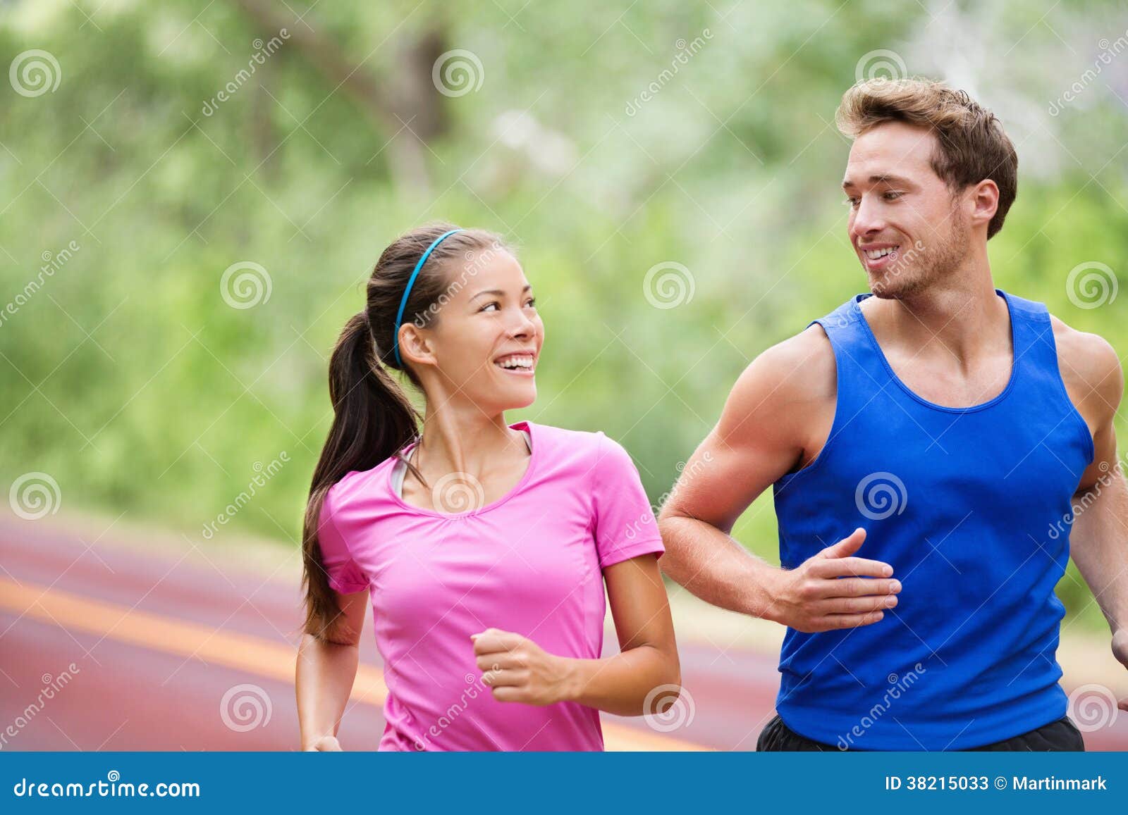 Healthy lifestyle - Running fitness couple jogging laughing, talking ...
