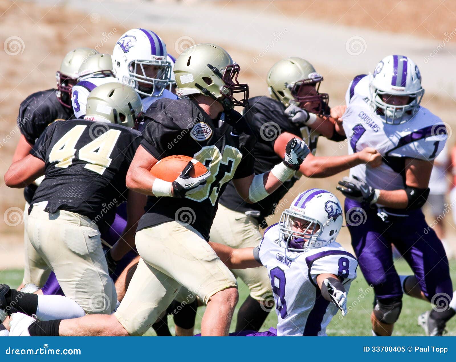 High School Football Player Running with the Ball Editorial Image High School Football Player Running with the Ball Editorial Image