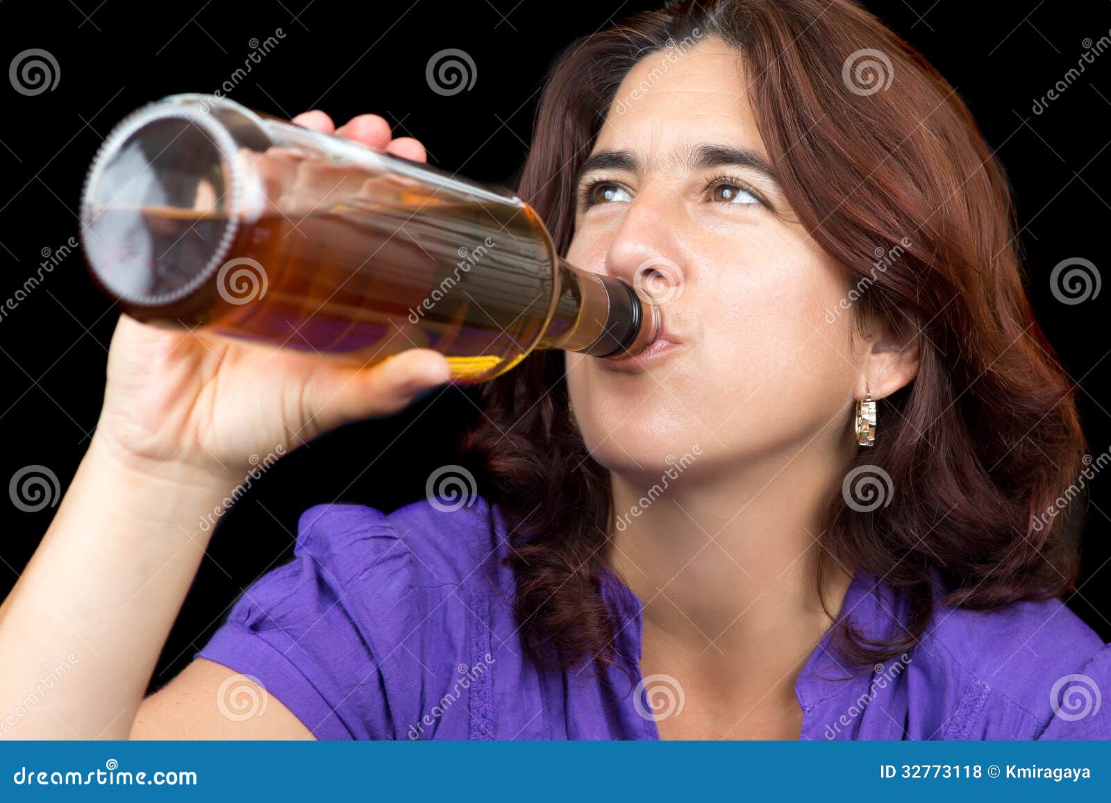 Hispanic Woman Drinking From A Whisky Or Rum Bottle Royalty Free Stock