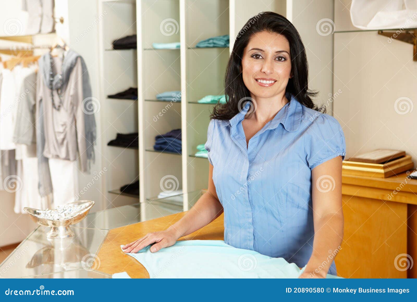 DownloadCancelClose. View all. Hispanic Woman Shopping In Clothing Store