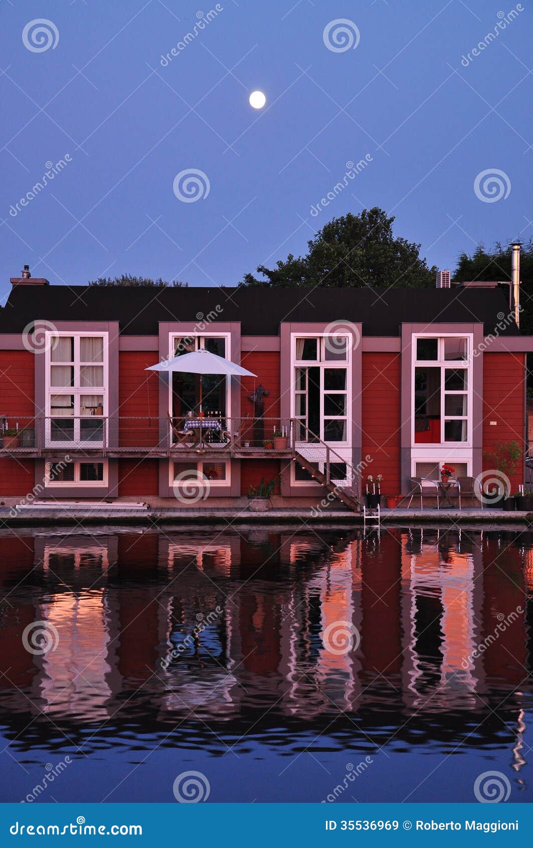Holland: Floating Dutch Houseboat And Moonshine. Royalty Free Stock 