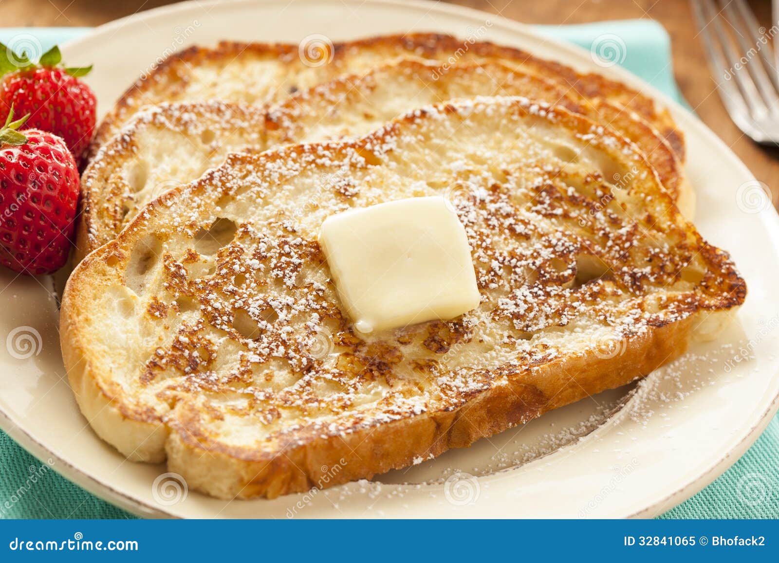 homemade-french-toast-butter-powdered-sugar-32841065.jpg