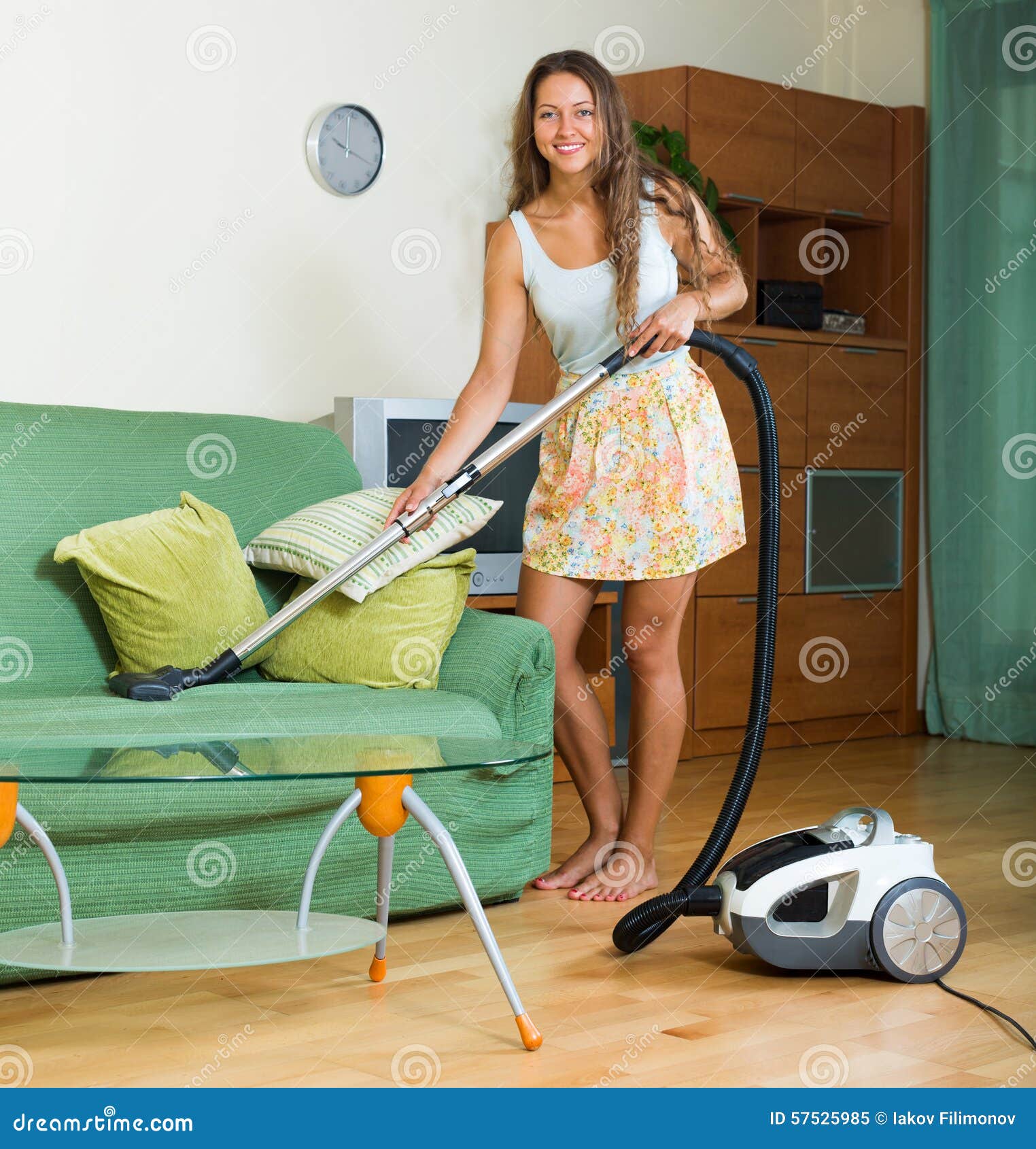 Housewife In Skirt Cleaning With Vacuum Cleaner Sto