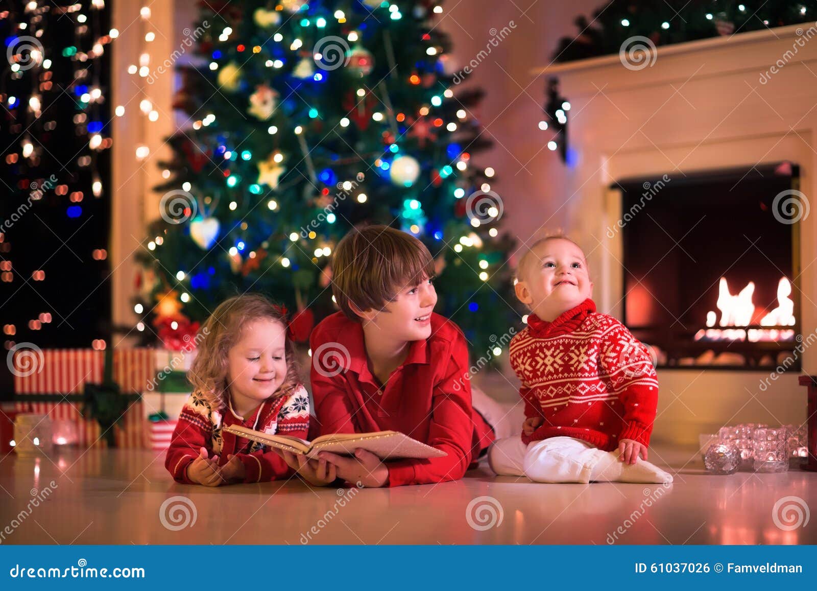 Kids Playing At Fireplace On Christmas Eve Stock Photo - Image: 61037026