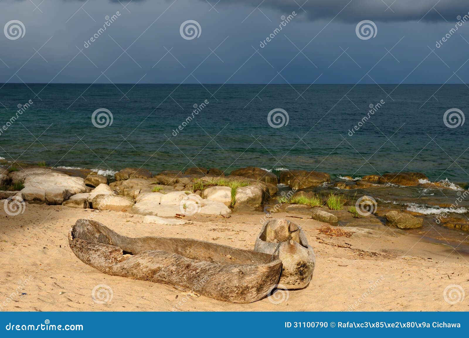 traditional dugout canoe or bwato on the beautiful sand beach