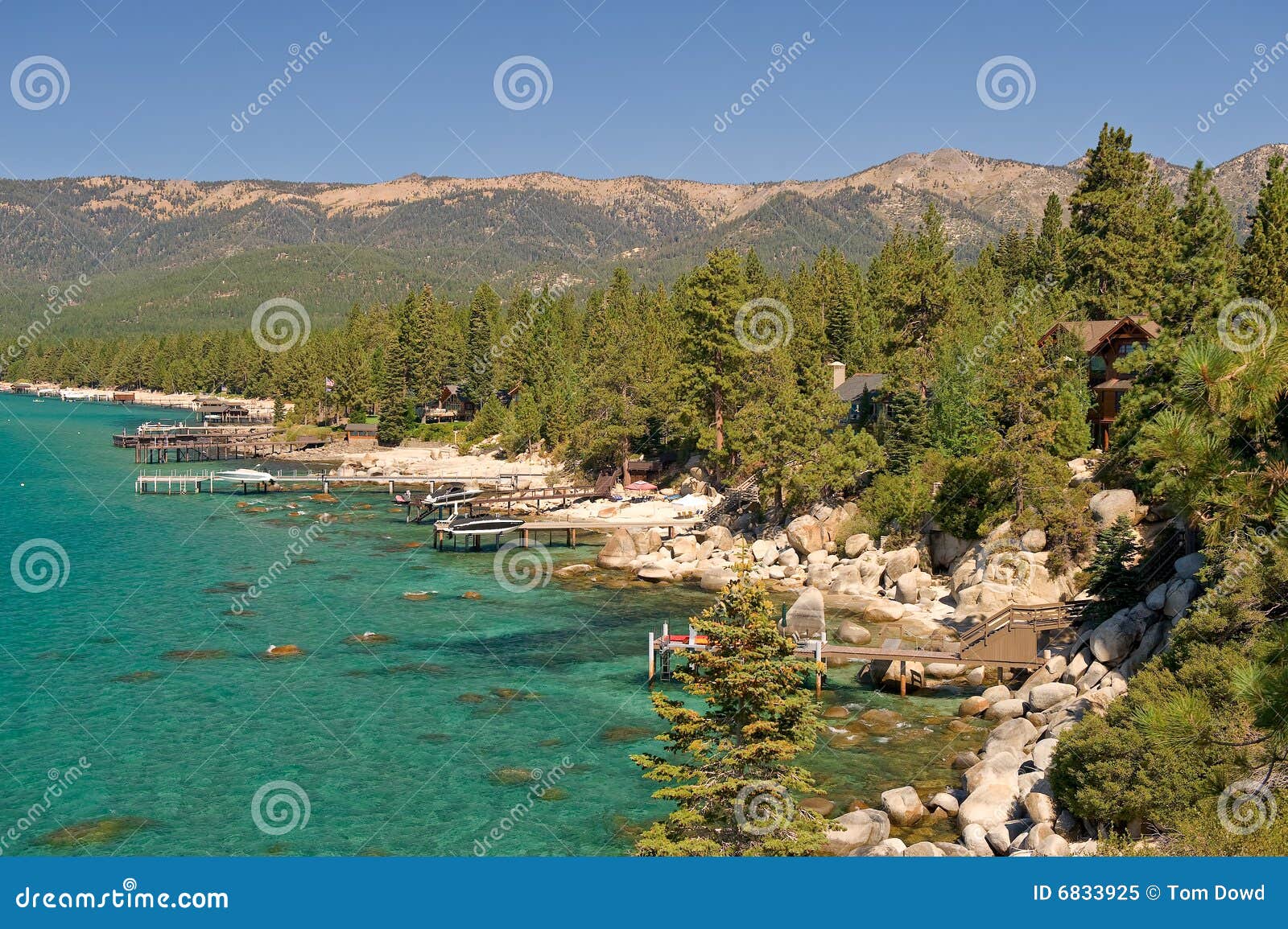 Scenic view of shoreline of Lake Tahoe with Sierra Nevada mountains in ...