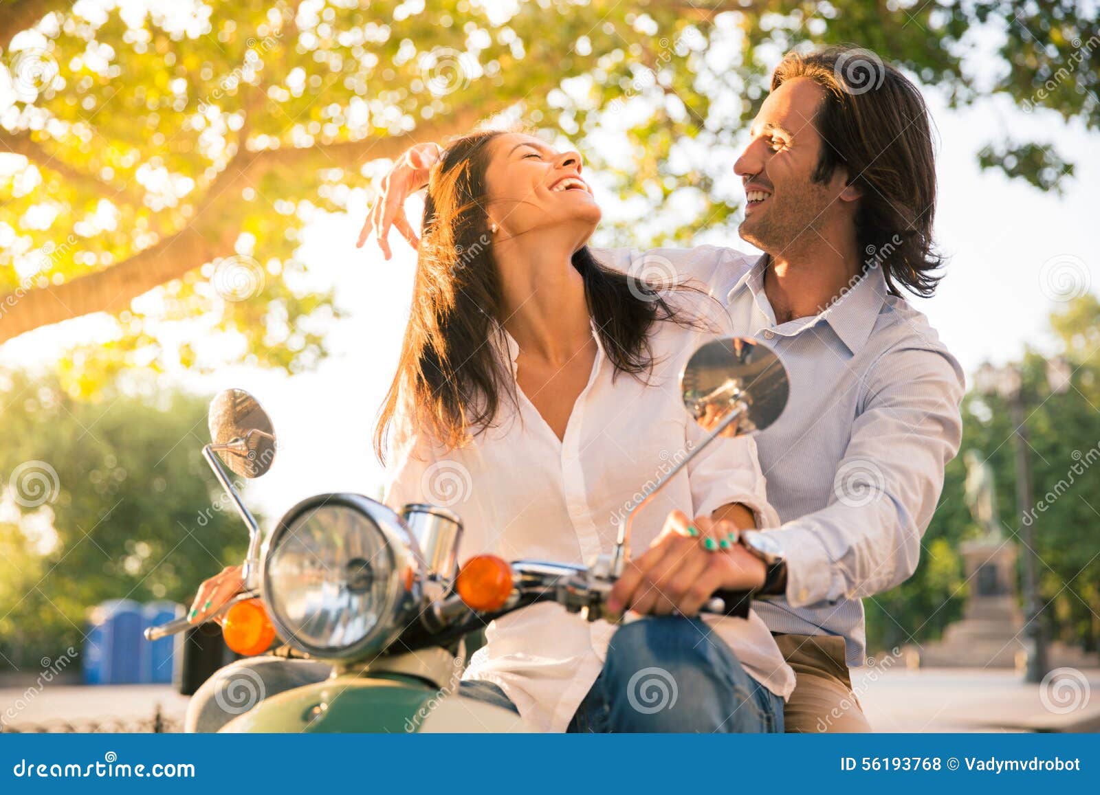 http://thumbs.dreamstime.com/z/laughing-european-couple-flirting-scooter-town-56193768.jpg