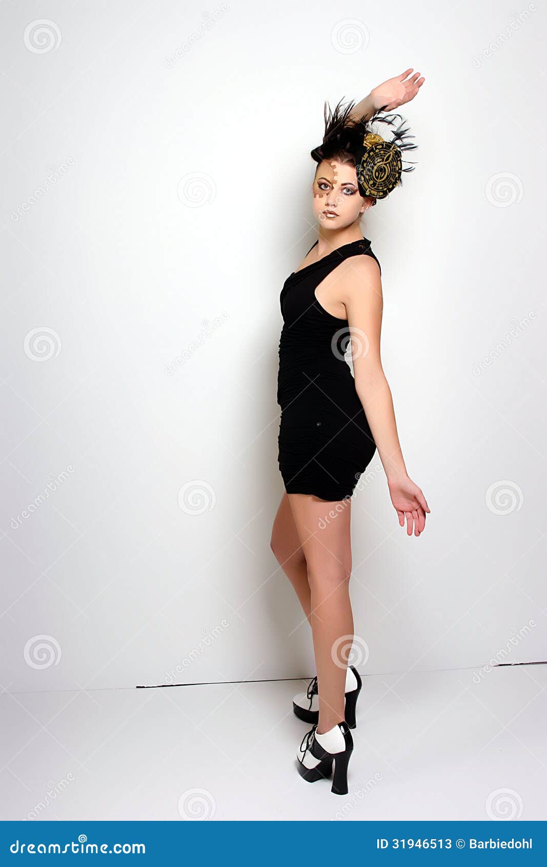 Woman dressed in a little black cocktail dress with a cute hat and ...