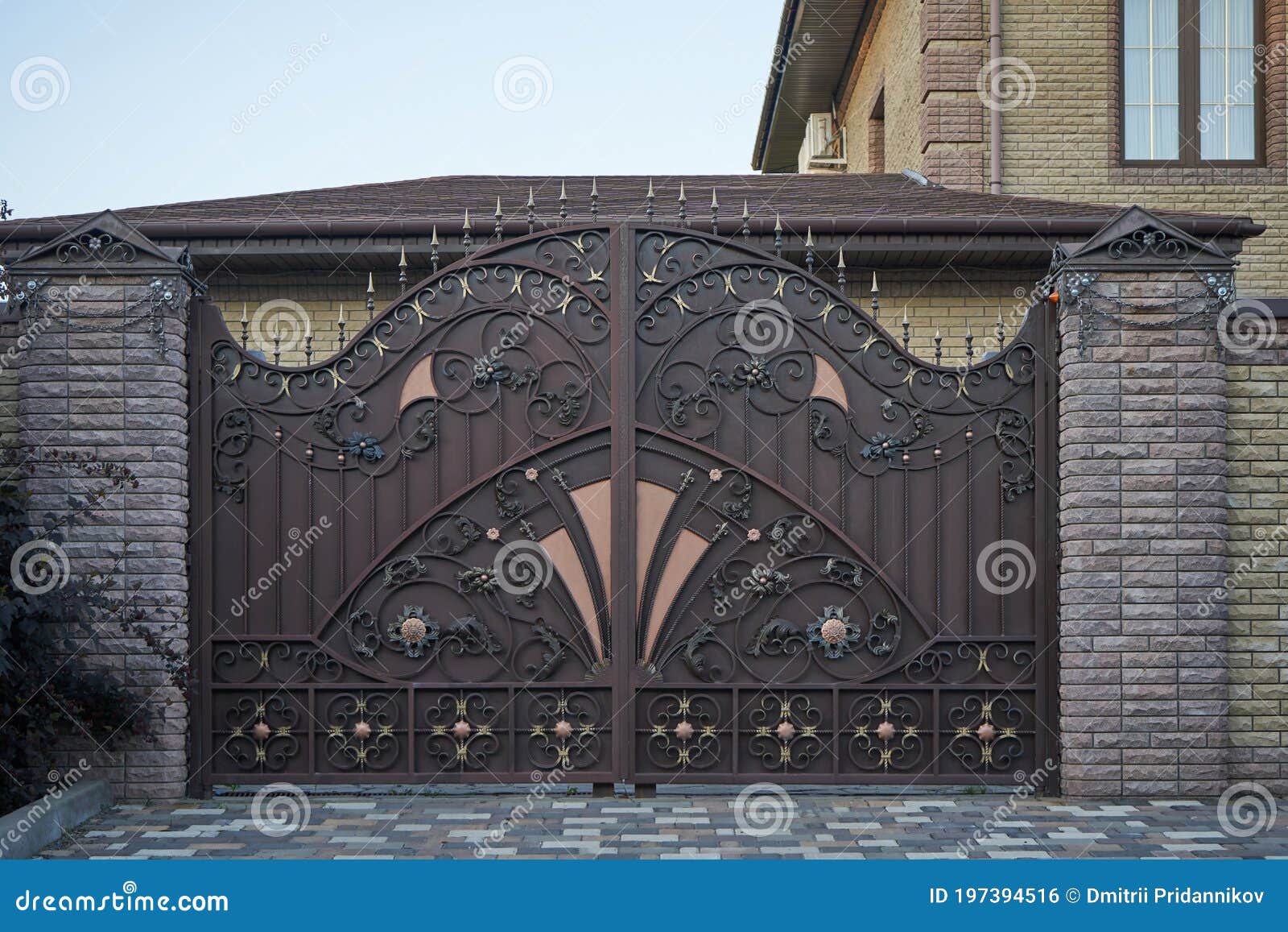 Luxurious Metal Forged Gates And Brick Fence In A Private House Stock