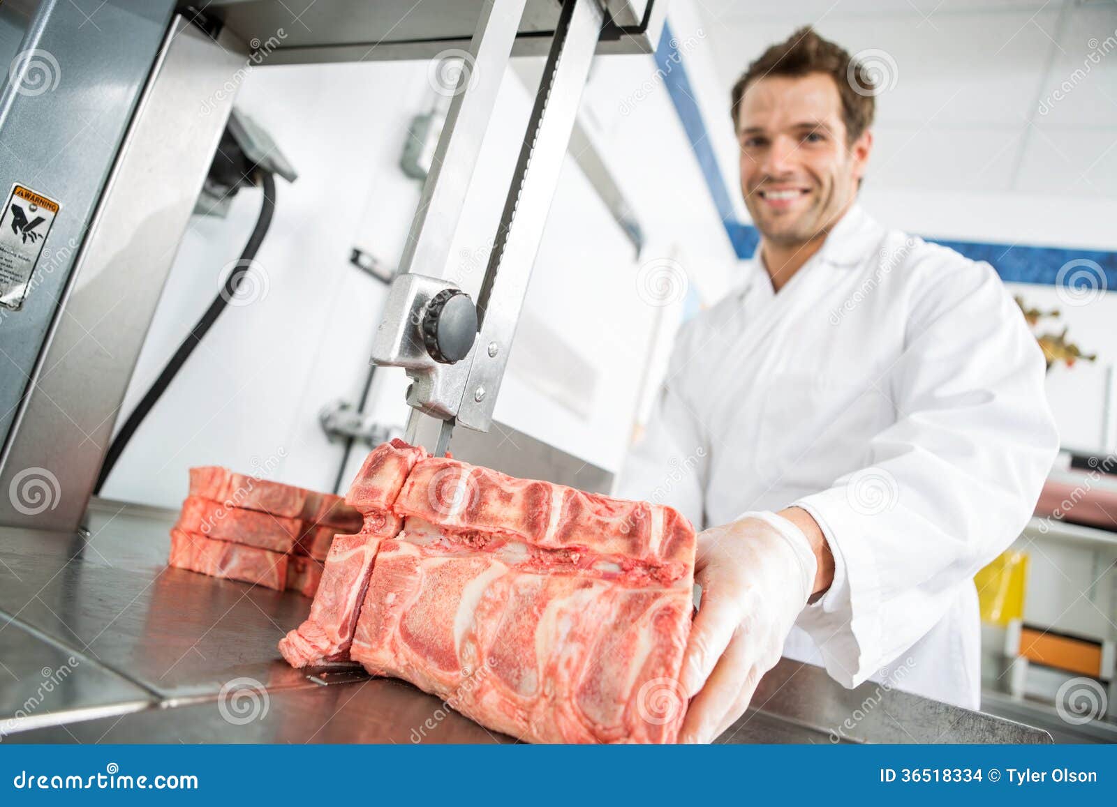 Male Butcher Cutting Meat On Bandsaw Stock Images - Image: 36518334