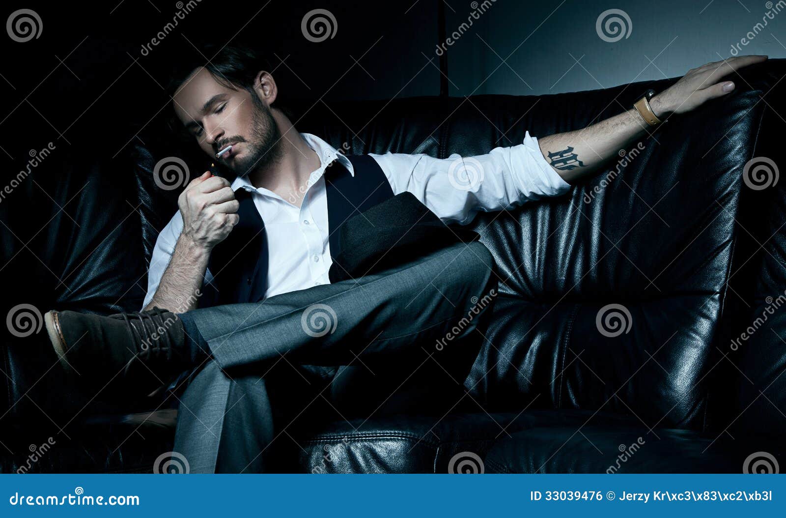 - man-black-couch-sexy-brunet-smoking-cigarette-33039476
