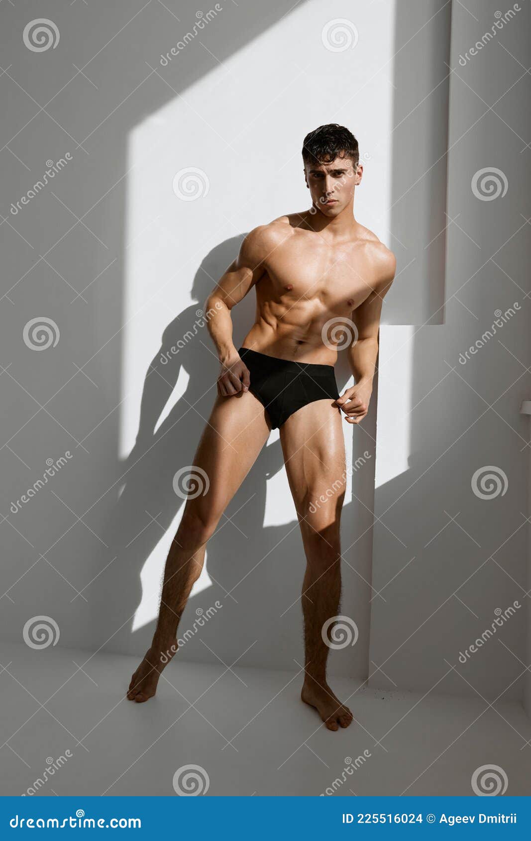 Man With Pumped Up Naked Body Black Panties Near The Window Stock Photo