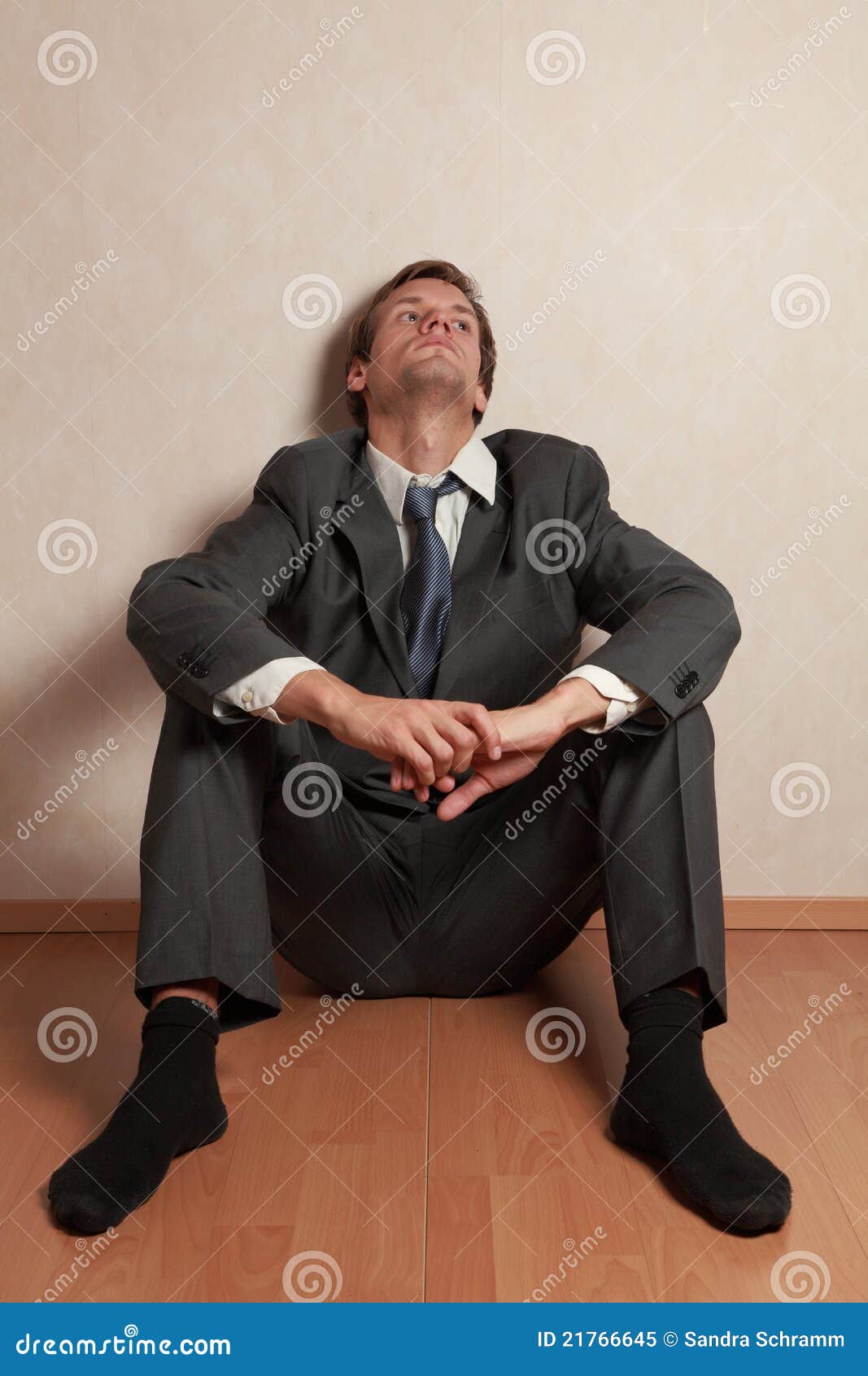 man-sitting-floor-21766645.jpg