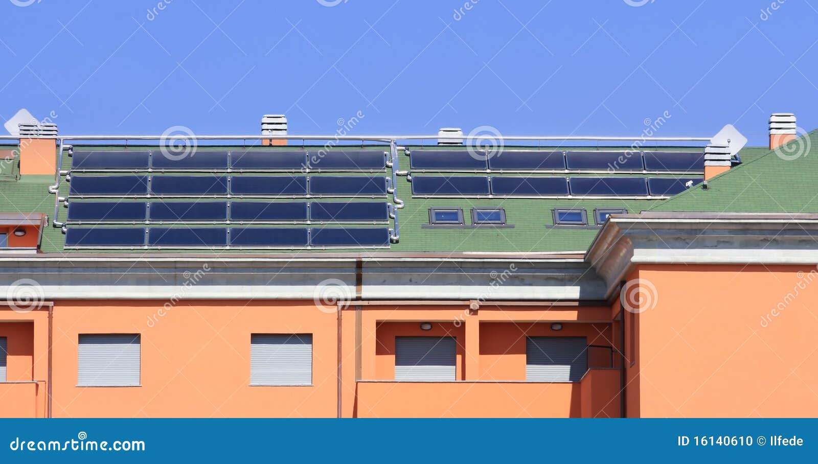 Solar collectors, used for hot water production, on a big roof.