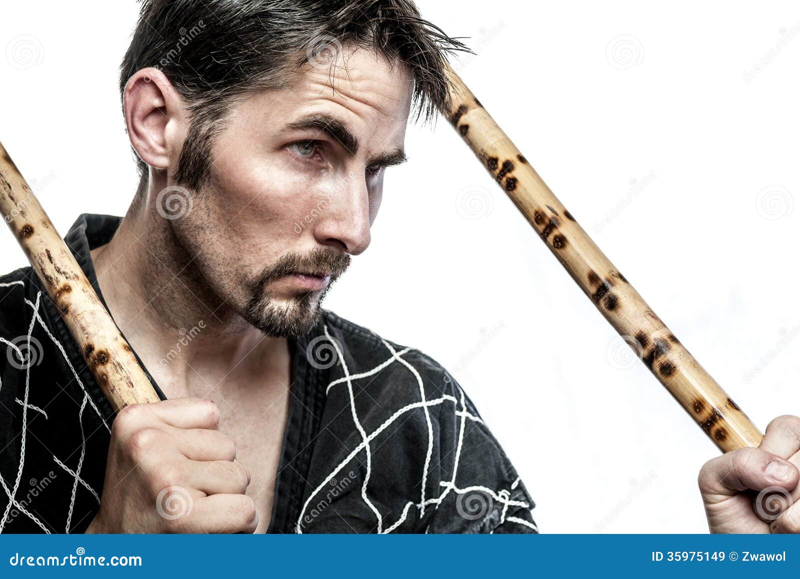 Martial arts master with bamboo sticks Royalty Free Stock Images - martial-arts-master-bamboo-sticks-black-combat-dress-two-short-isolated-white-background-35975149