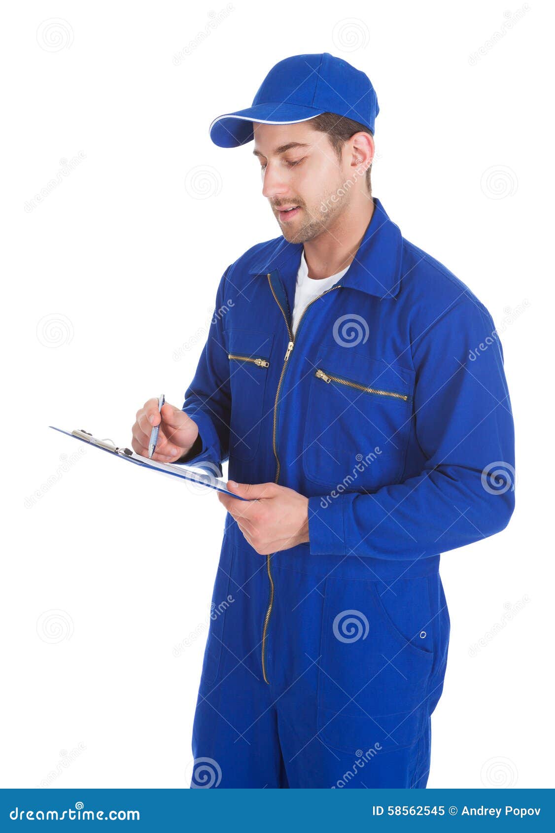 Mechanic In Overall Writing On Clipboard Stock Photo - Image: 58562545