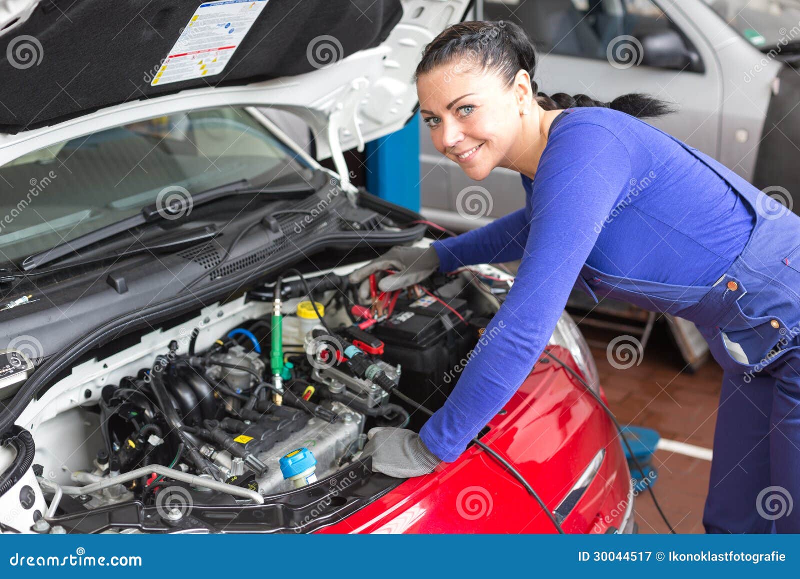 Royalty Free Stock Photography: Mechanic repairing a car in a workshop ...