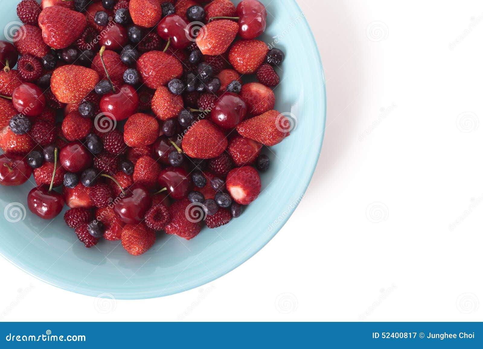 Blueberries in a wooden bowl Top view Ripe and tasty