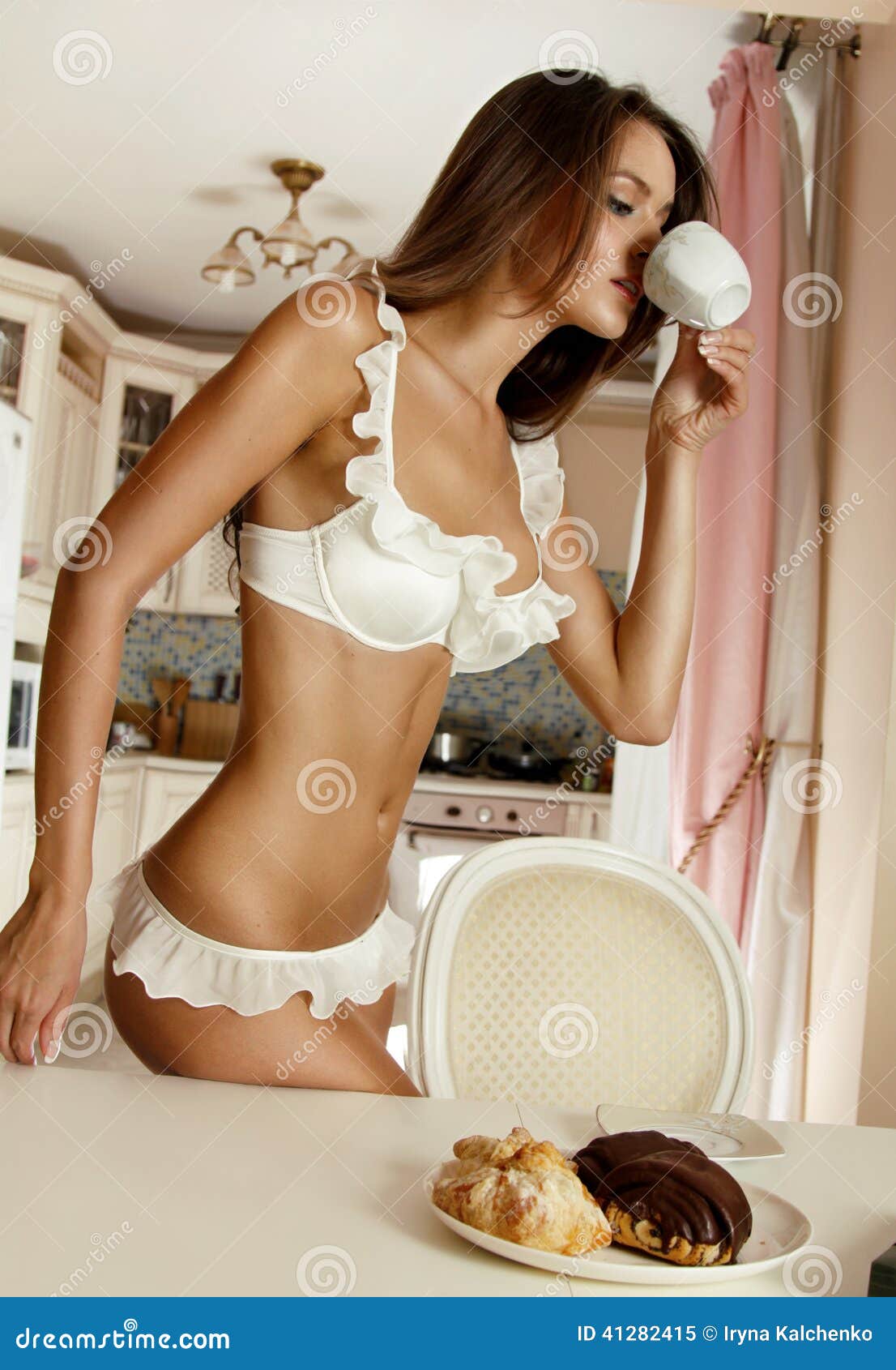 morning-young-beautiful-girl-begins-cup-coffee-savory-biscuits-chocolate-dressed-white-lingerie-41282415.jpg