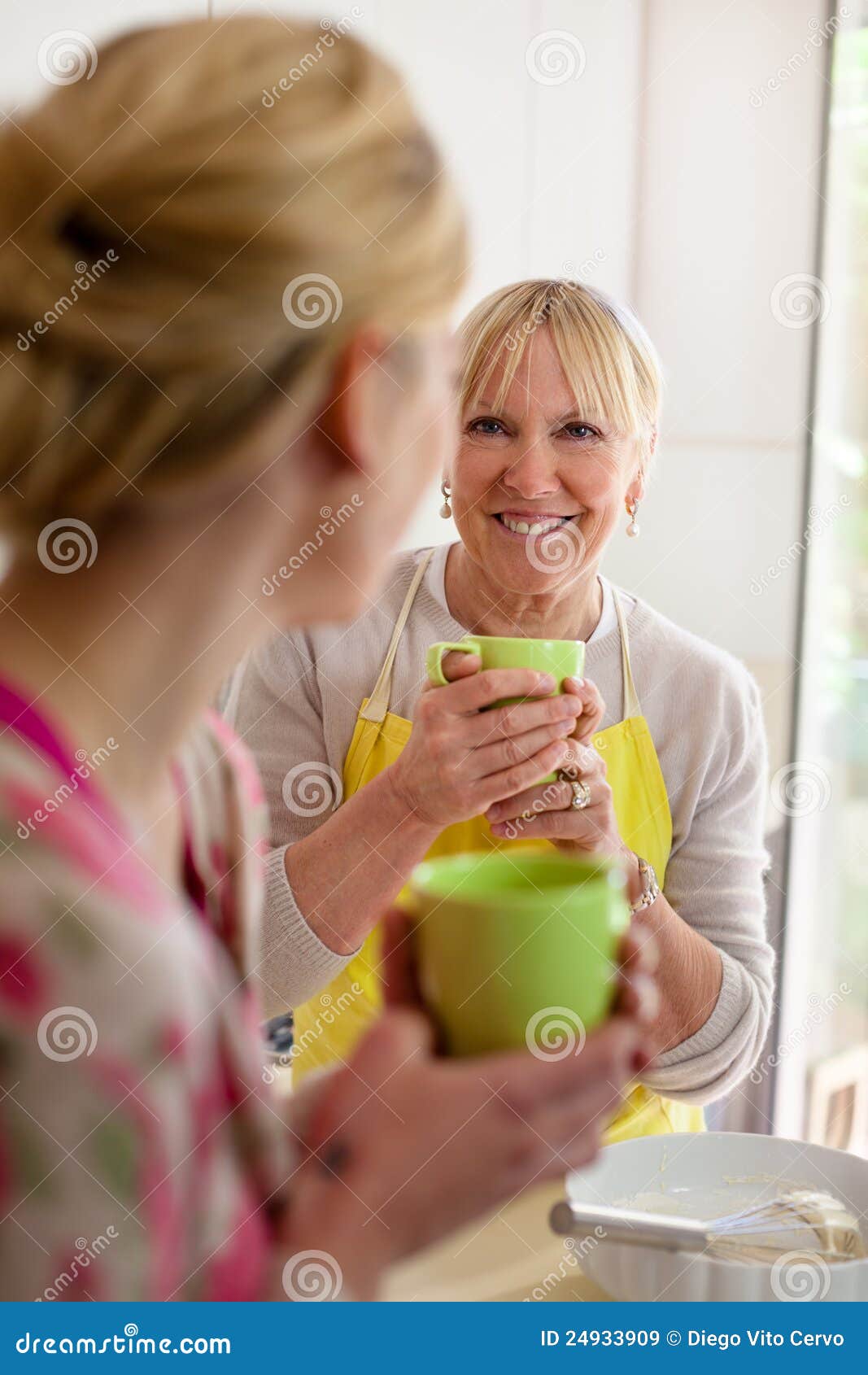 Mother And Daughter Drinking Coffee In Kitchen Royalty Free Stock Images Image 24933909