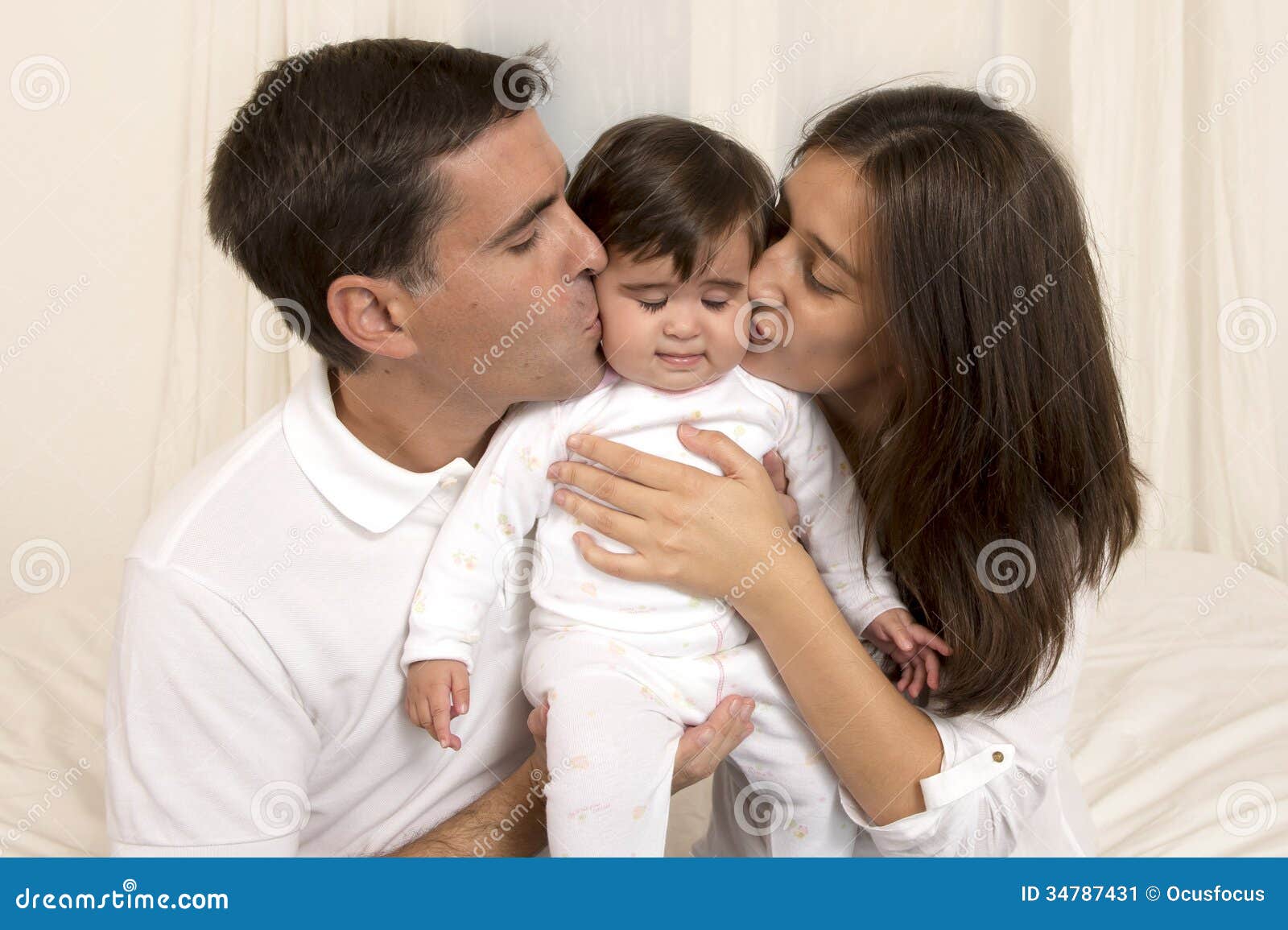 Mother And Father Kissing Daughter Stock Image Image 34787431
