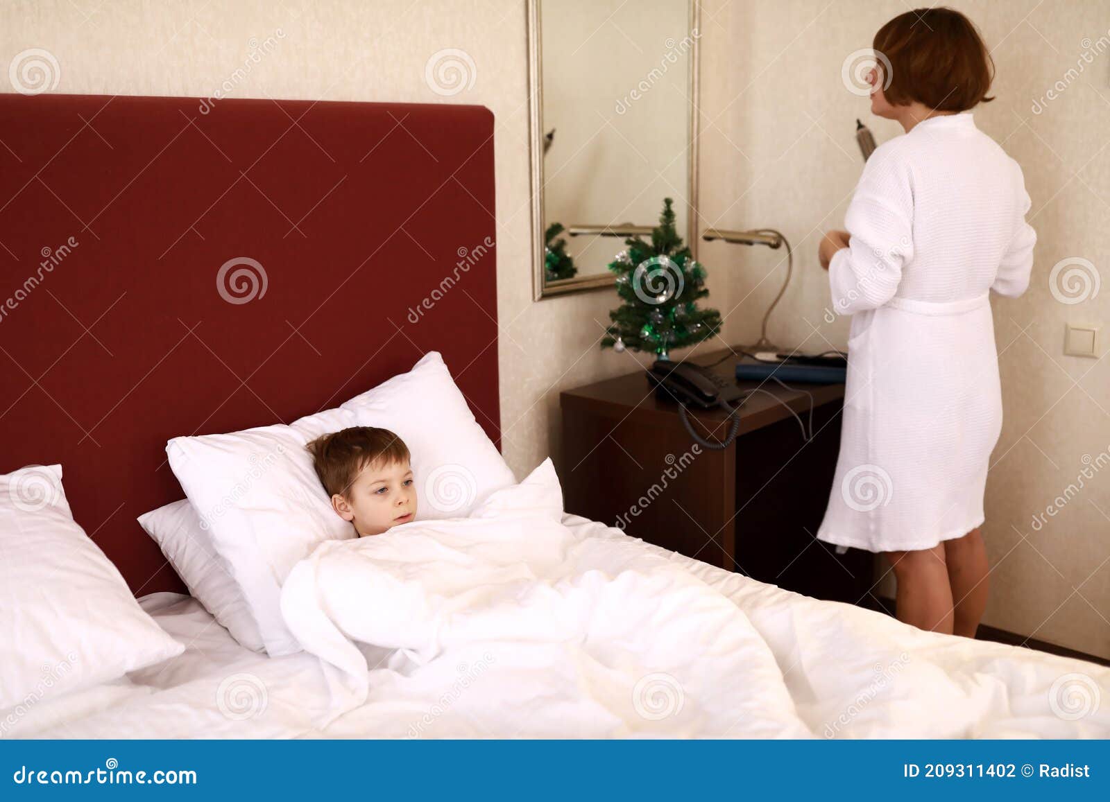 Mother With Son In Hotel Room Stock Photo Image Of Morning Asleep
