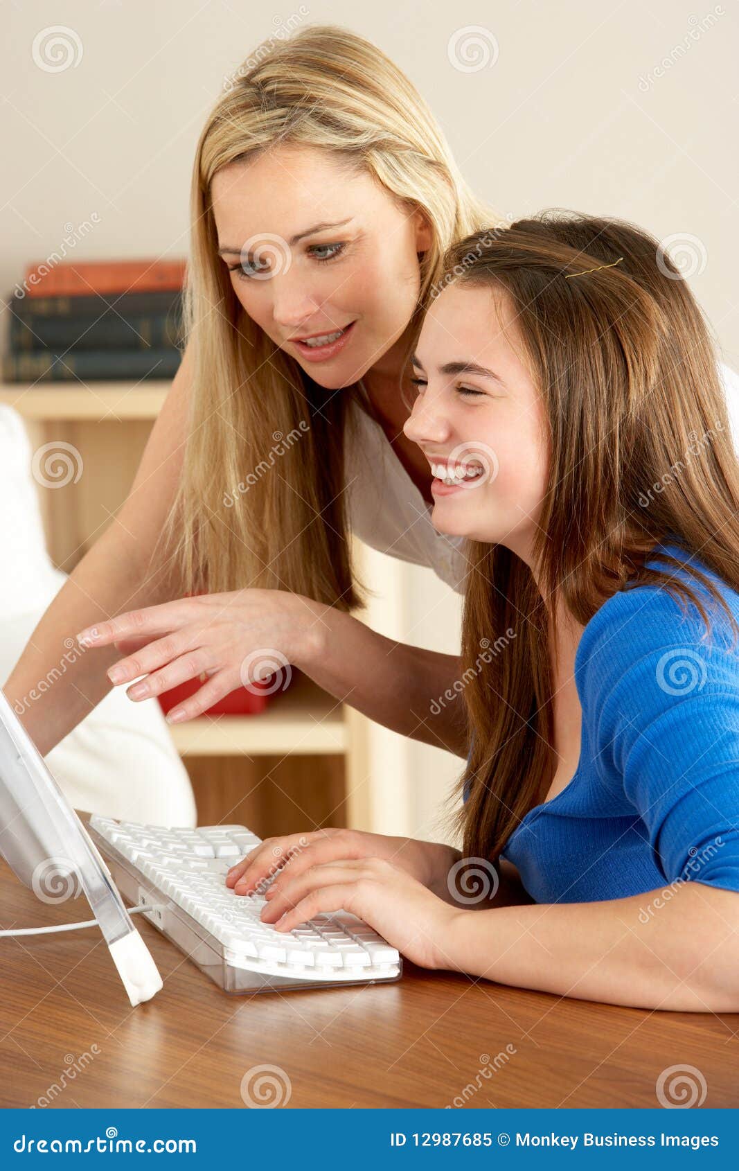 Mother And Daughter Using Tablet Computer Stock Photo 