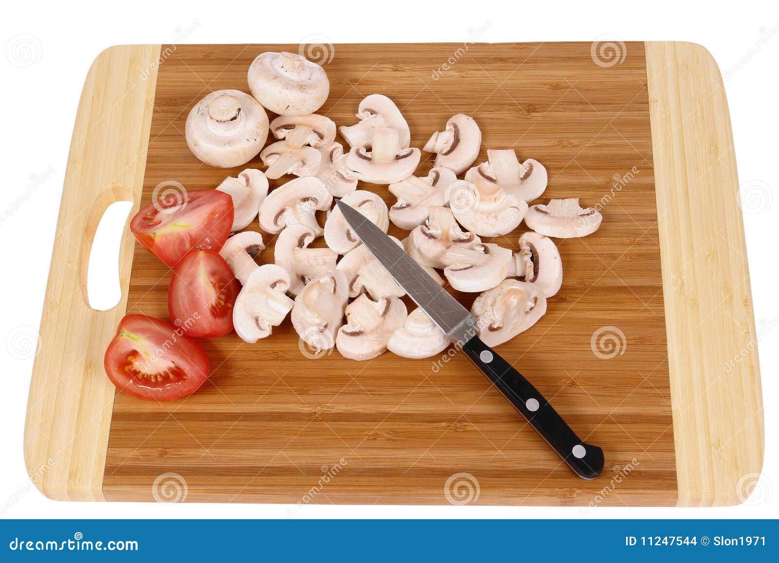 Mushrooms to cut on brown chopping board.