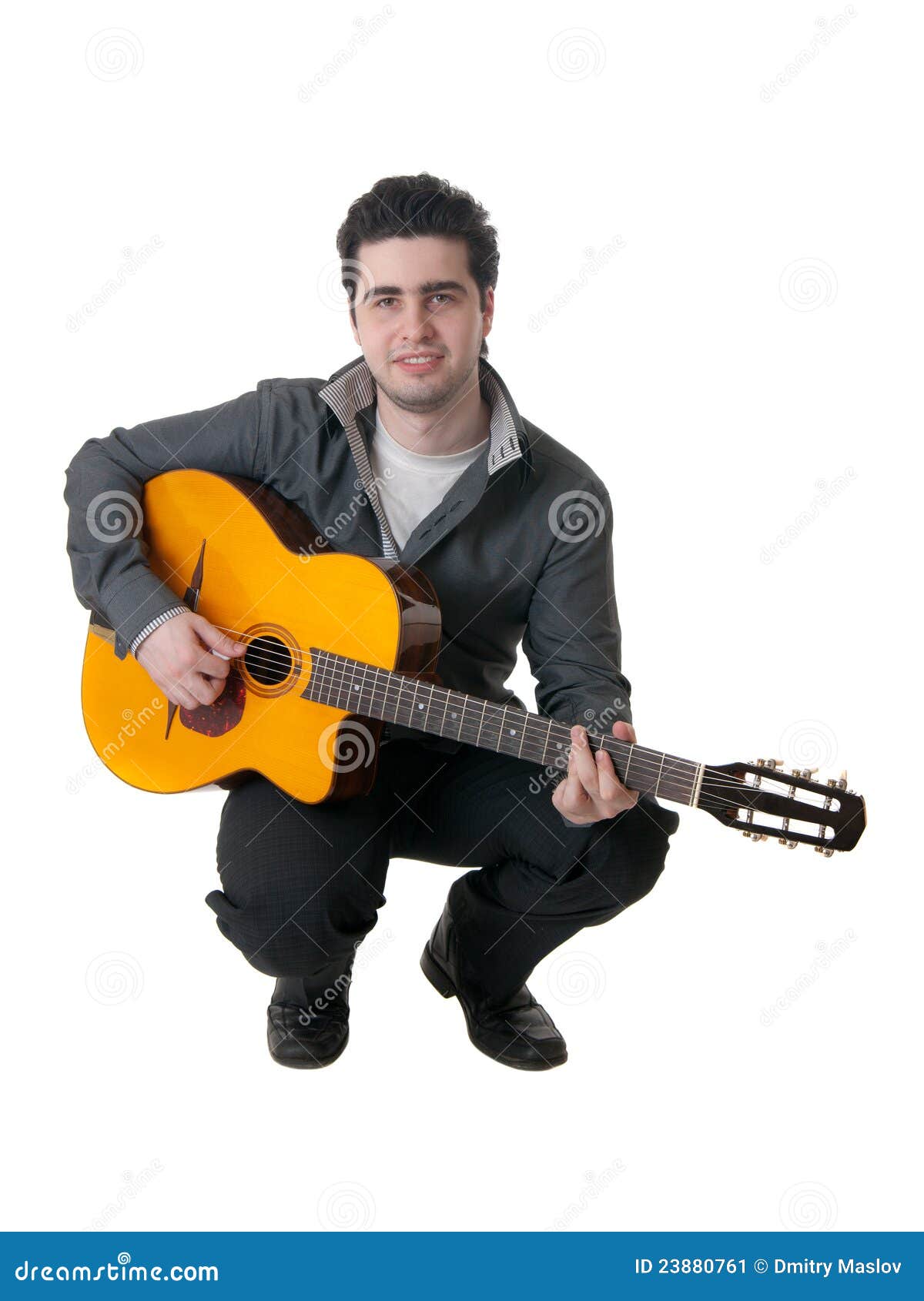 The musician plays an acoustic guitar, isolated.