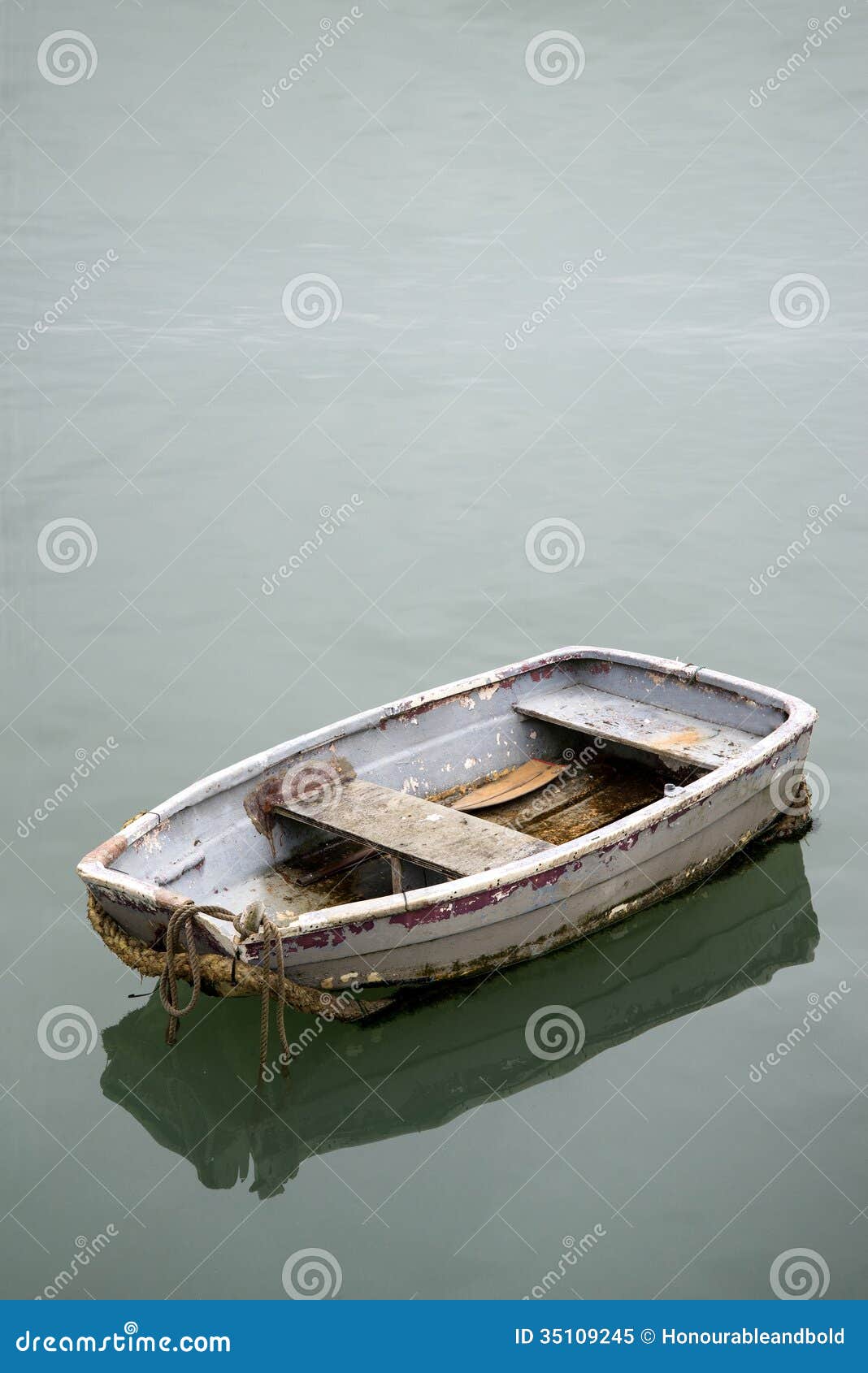 Neglected Old Rowing Boat On Calm Sea Water Royalty Free Stock Photo 