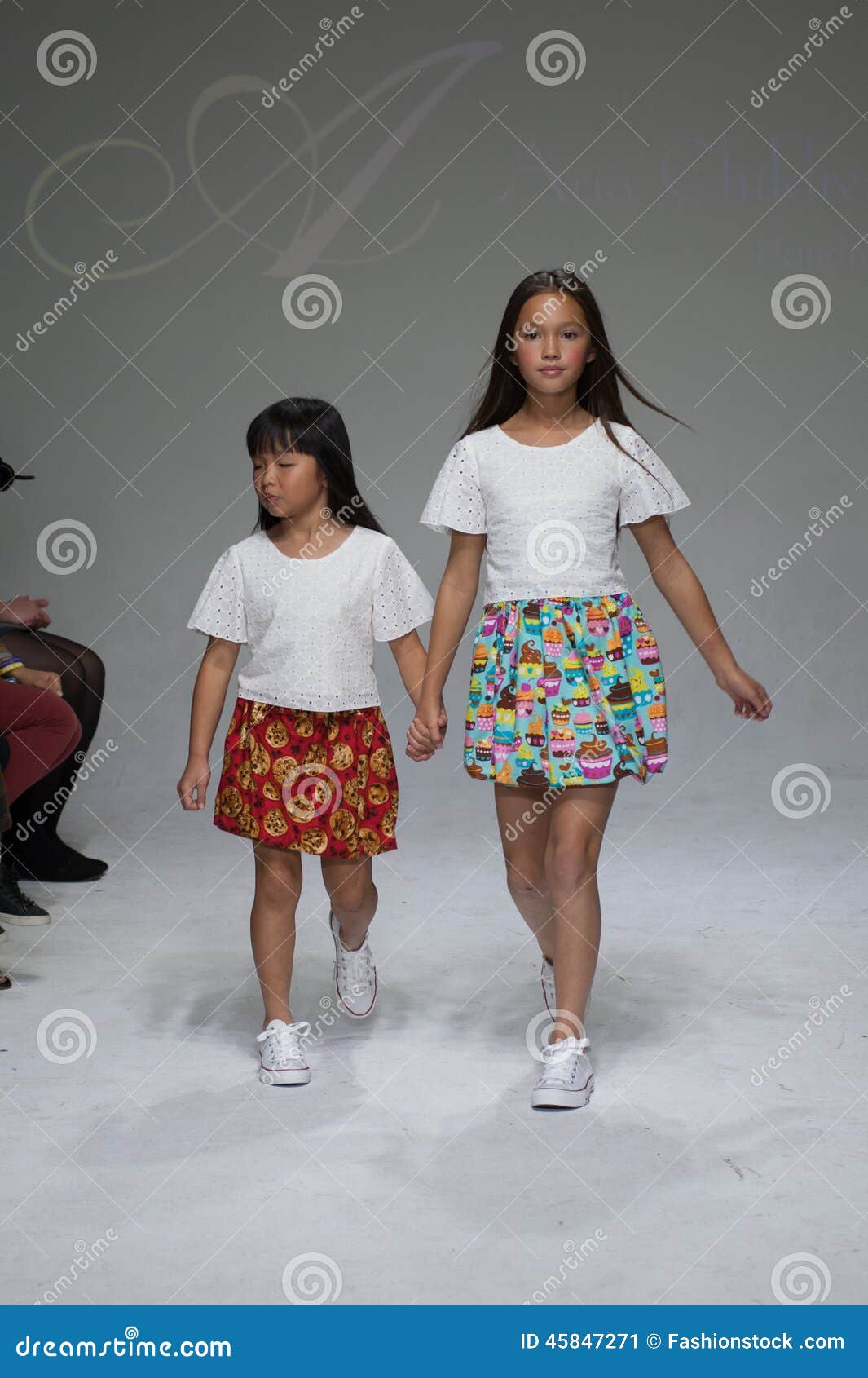 NEW YORK, NY - OCTOBER 19: Models Walk The Runway During The Aria Children&#39;s Clothing Preview At ...