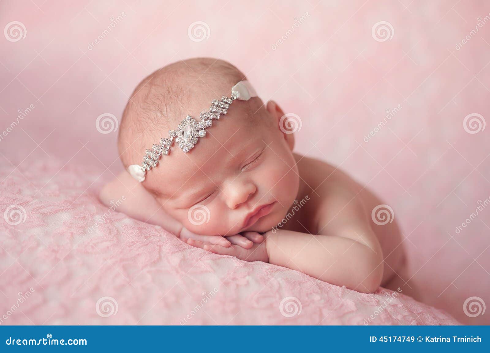 937 New baby headband subscription 65 Portrait of 10 day old newborn baby girl. She is wearing a rhinestonel   