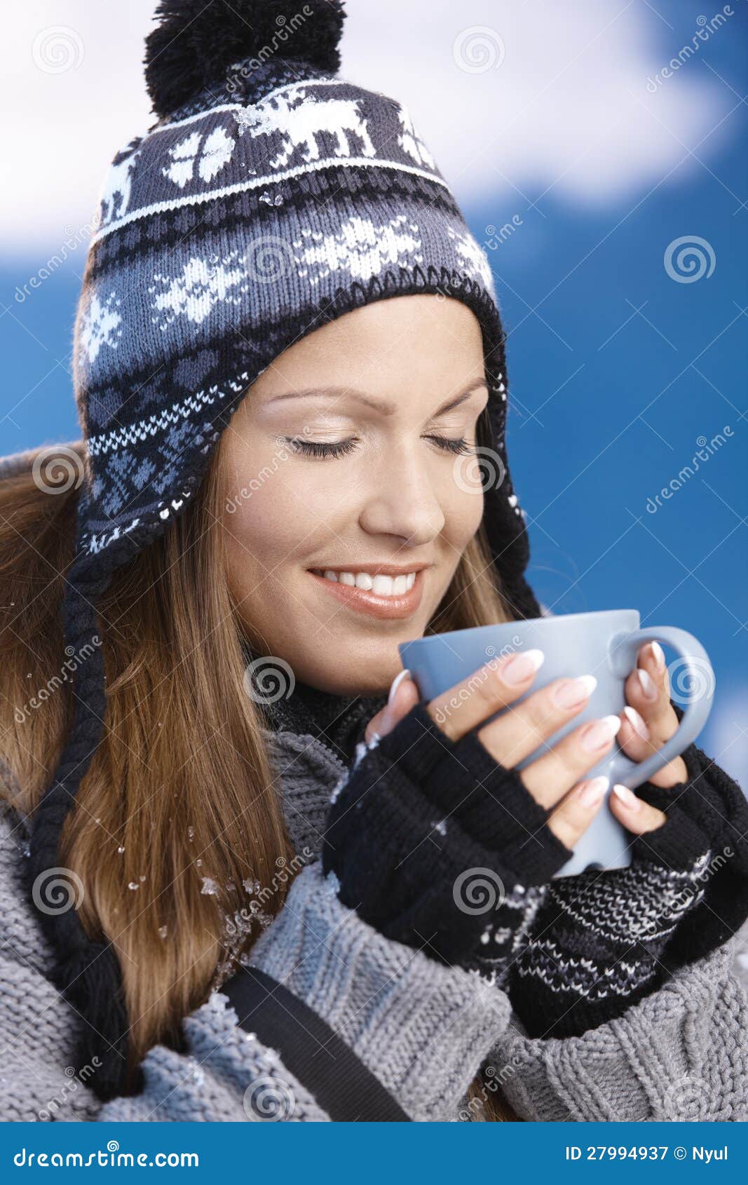 Nice girl drinking hot tea in winter eyes closed - nice-girl-drinking-hot-tea-winter-eyes-closed-27994937
