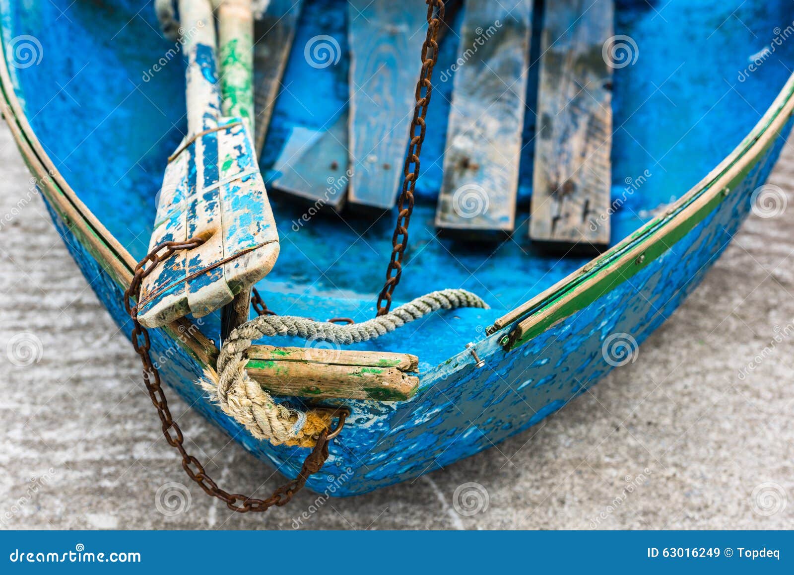 Old blue wooden shabby fishing boat detail. Shot with a selective 