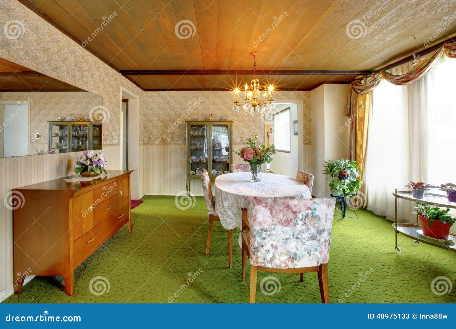 Old fashioned house interior with antique cabinets, green carpet floor 