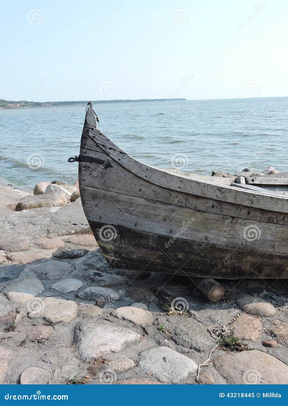 Old wooden fishing boat on Curonian Bay shore, Lithuania.