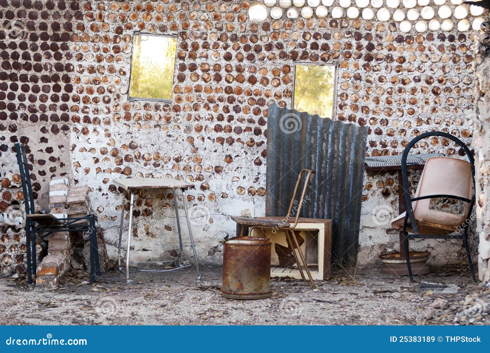 Interior of an old home built from tin cans with old furniture.