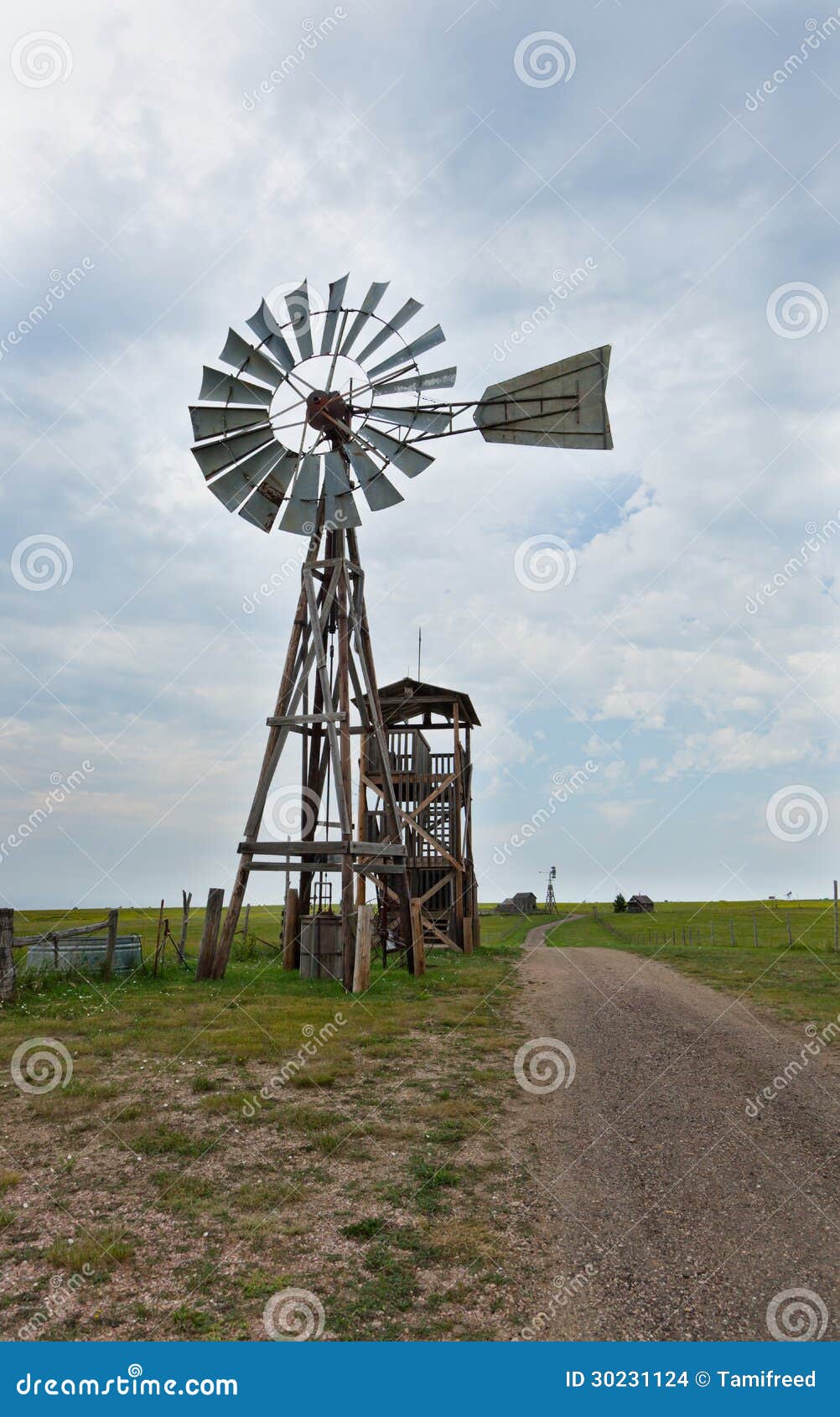 An old western windmill, used to pump water out of a well, made of 