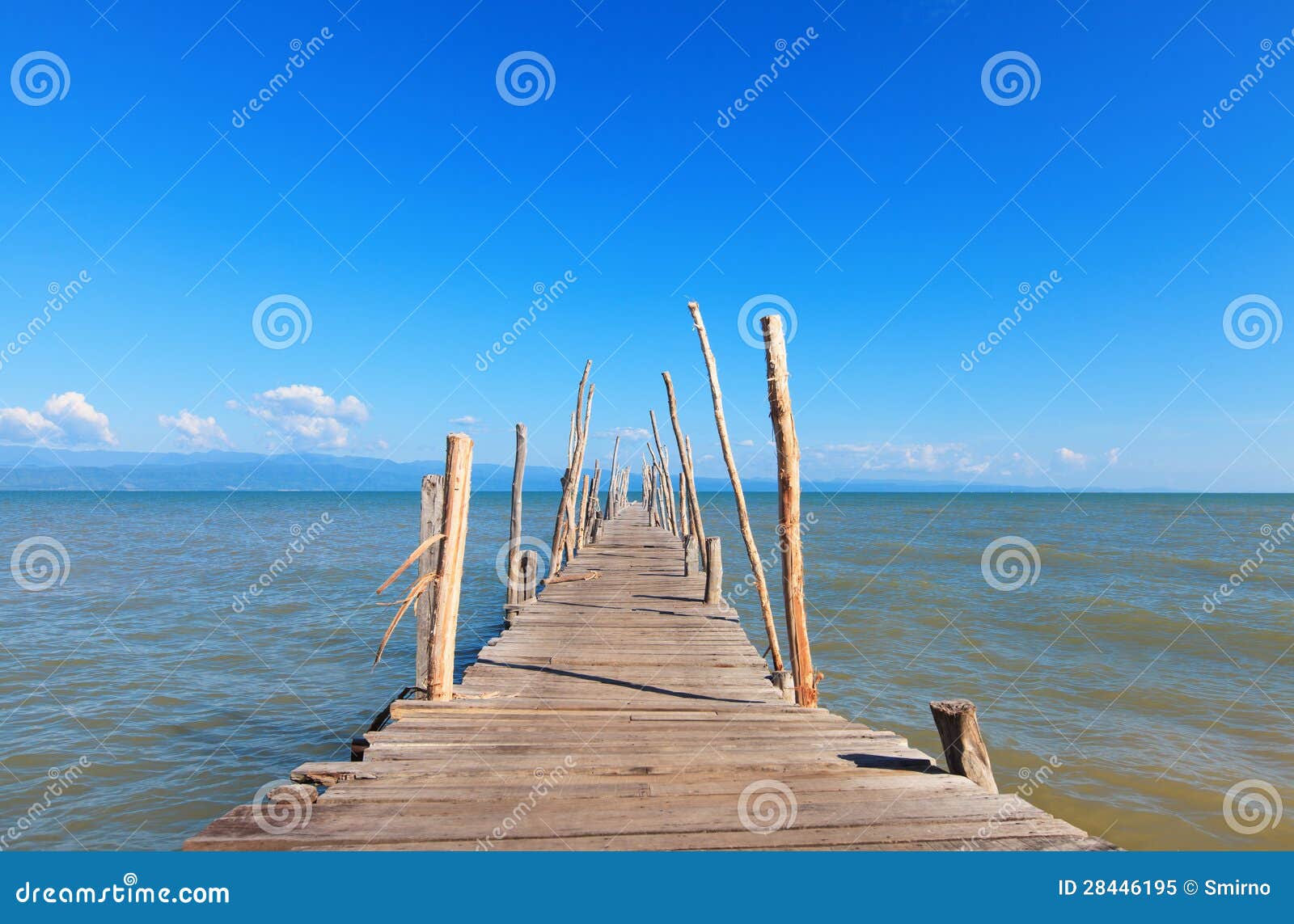 Old Wooden Boat Dock, Going Far Out To Sea. Royalty Free Stock Photo 