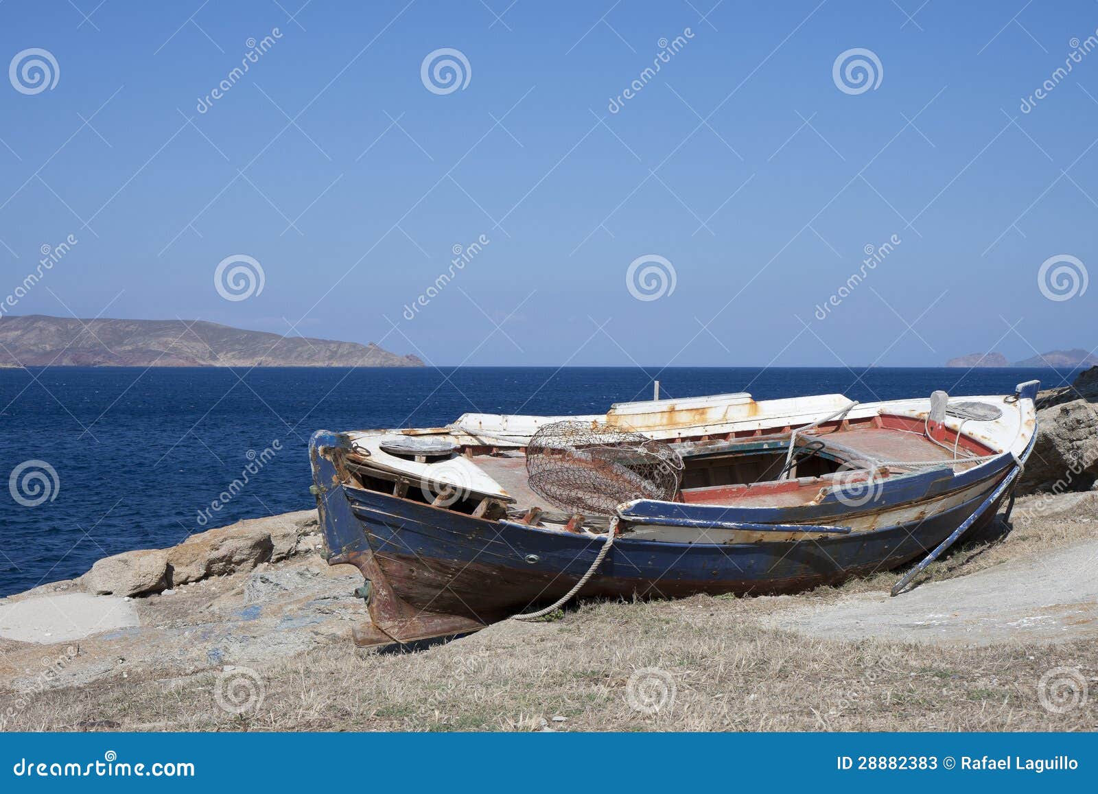 Old wooden fisher boat in Agia Anna, Mykonos , Greece.