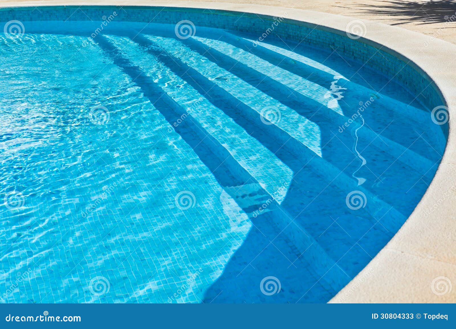 Outdoor Swimming pool with staircase. Horizontal shot.