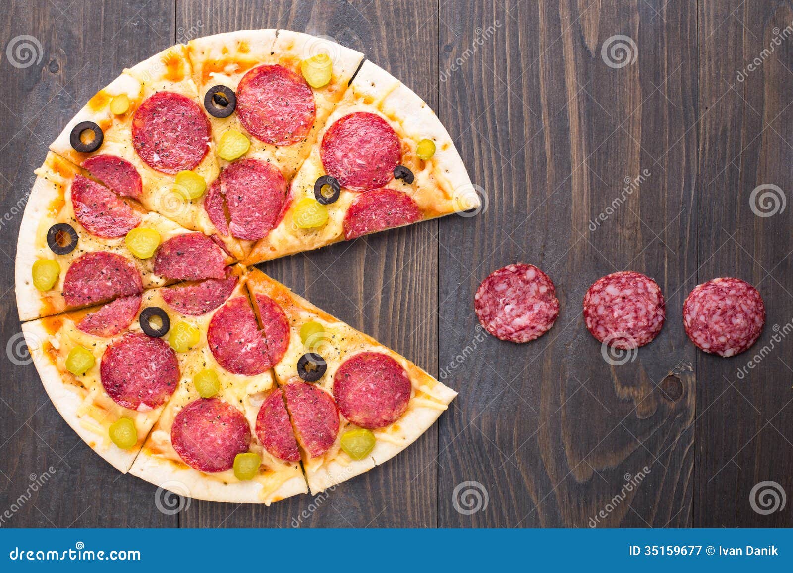 pacman-pizza-eatting-salami-table-35159677.jpg