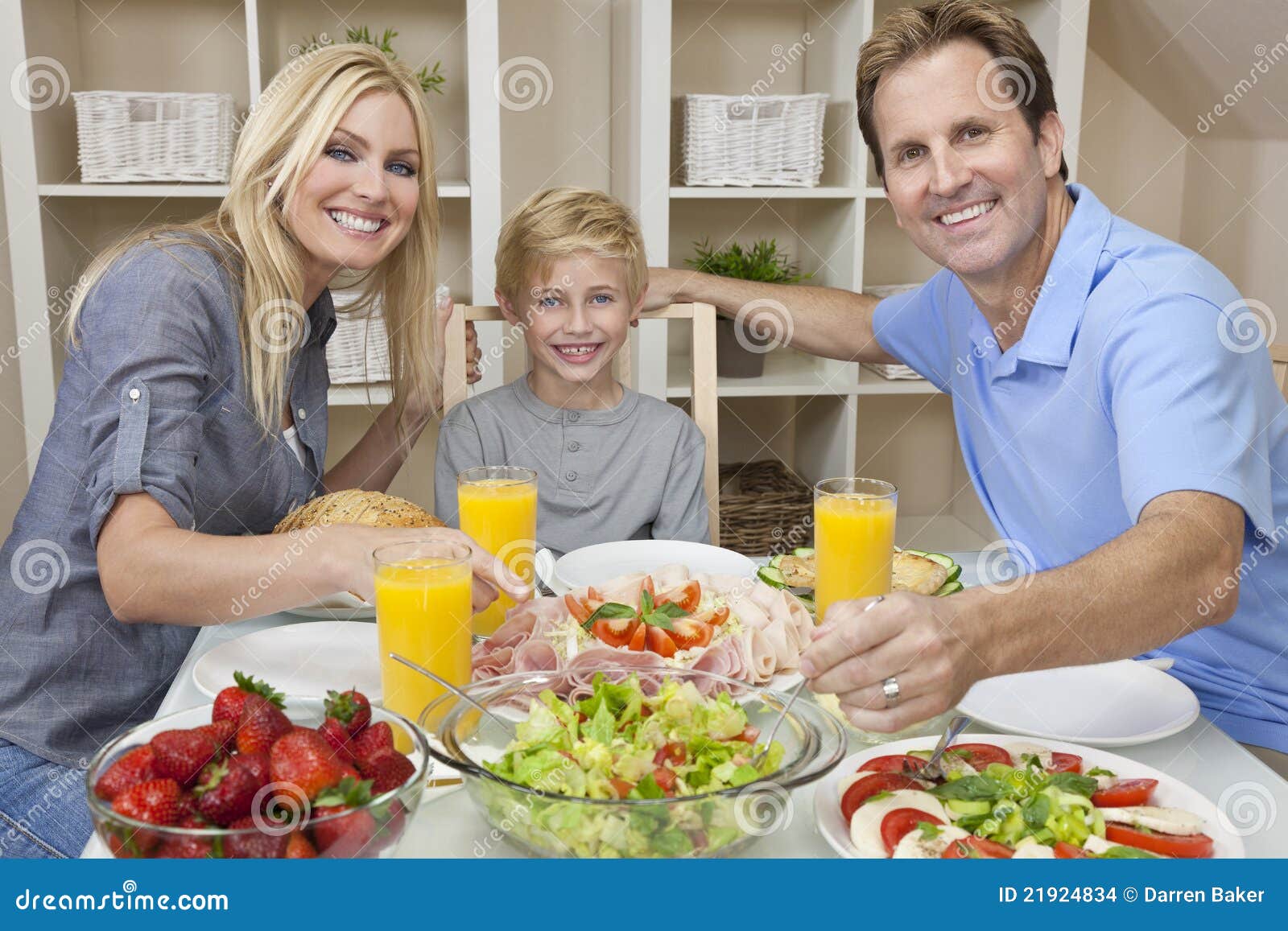 Parents Child Family Healthy Food At Dining Table Stock Images ...