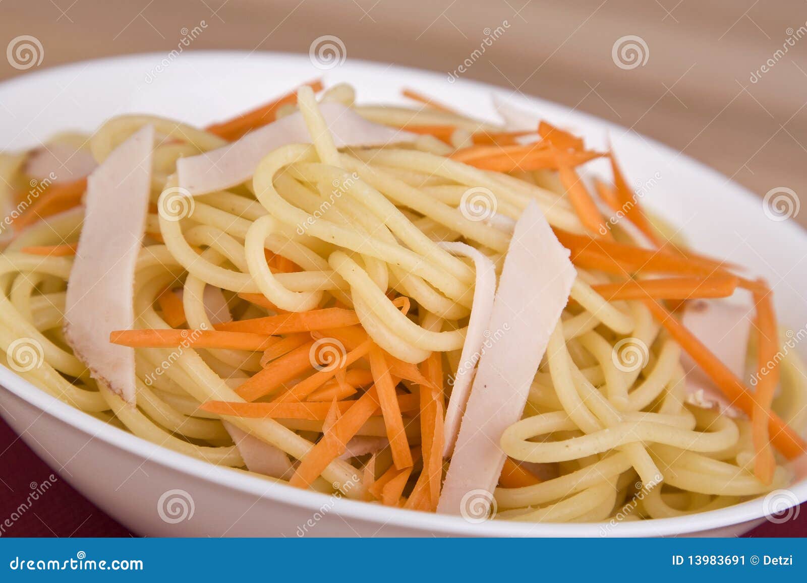 Stock Image: Pasta salad with carrot and meat