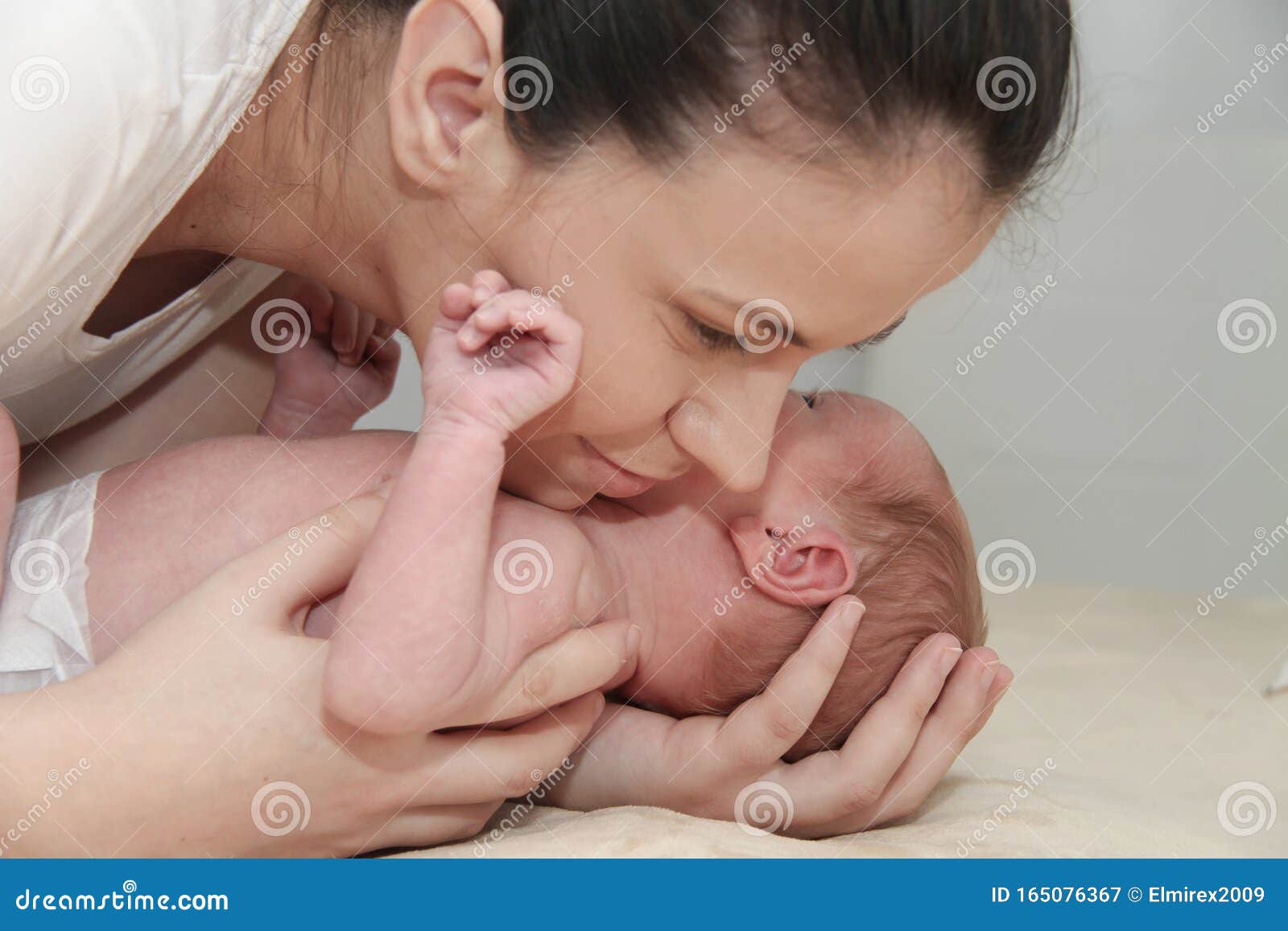 Mother And Her Newborn Baby Parent Holding Newborns Hands Stock Image